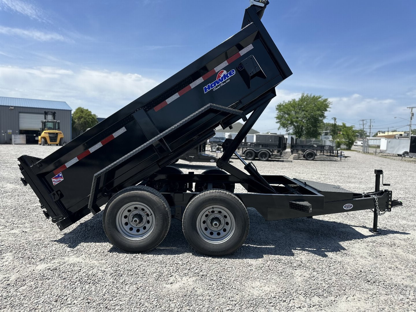 New 2024 HAWKE TRAILERS 6X10 10K Dump w/ Spreader Gate and Ramps Dump Trailer
