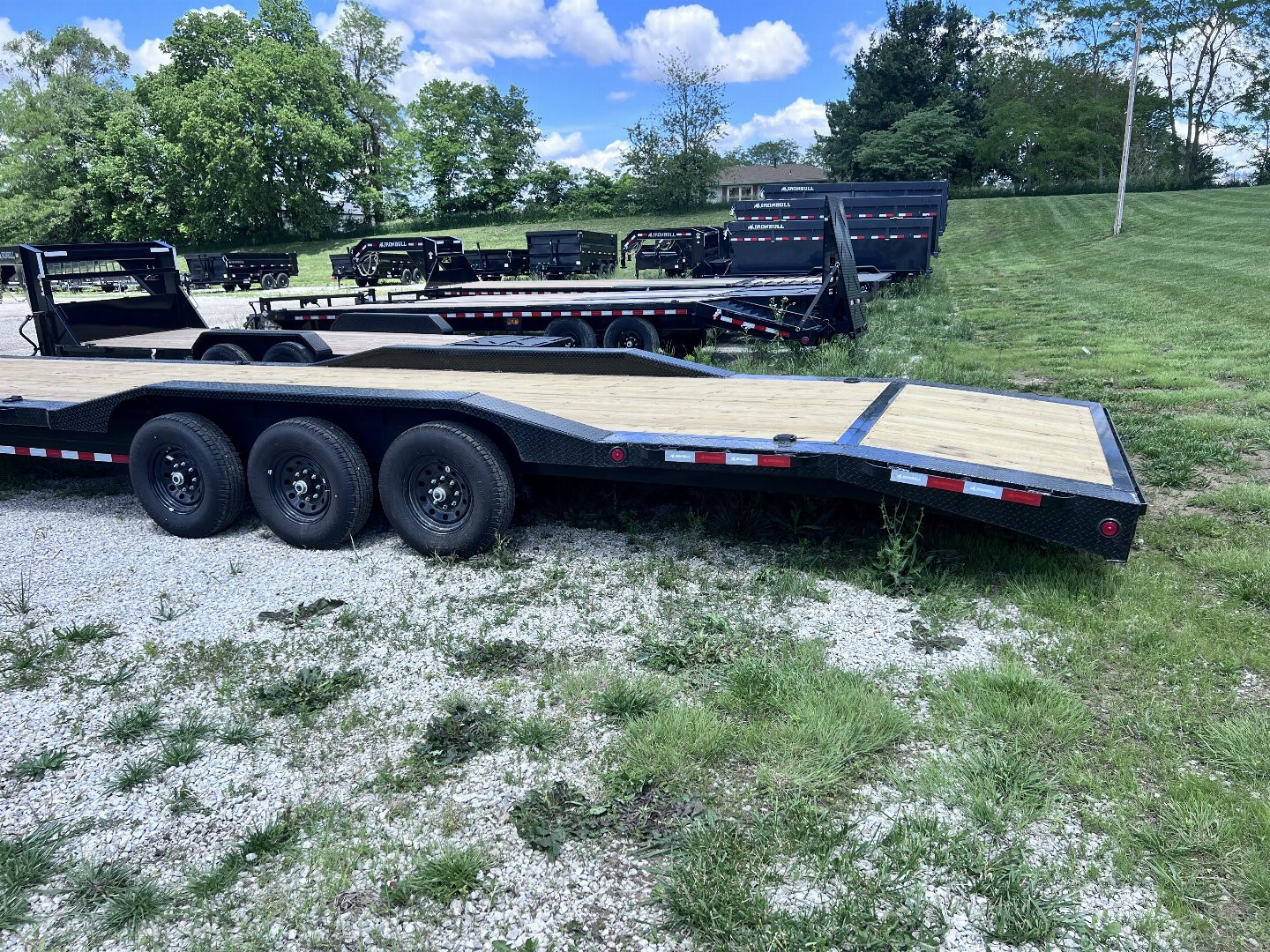 New 2026 IRON BULL 102 X 40 GOOSENECK EQUIPMENT TRAILER W/ TRIPLE AXLES AND DRIVE OVER FENDERS