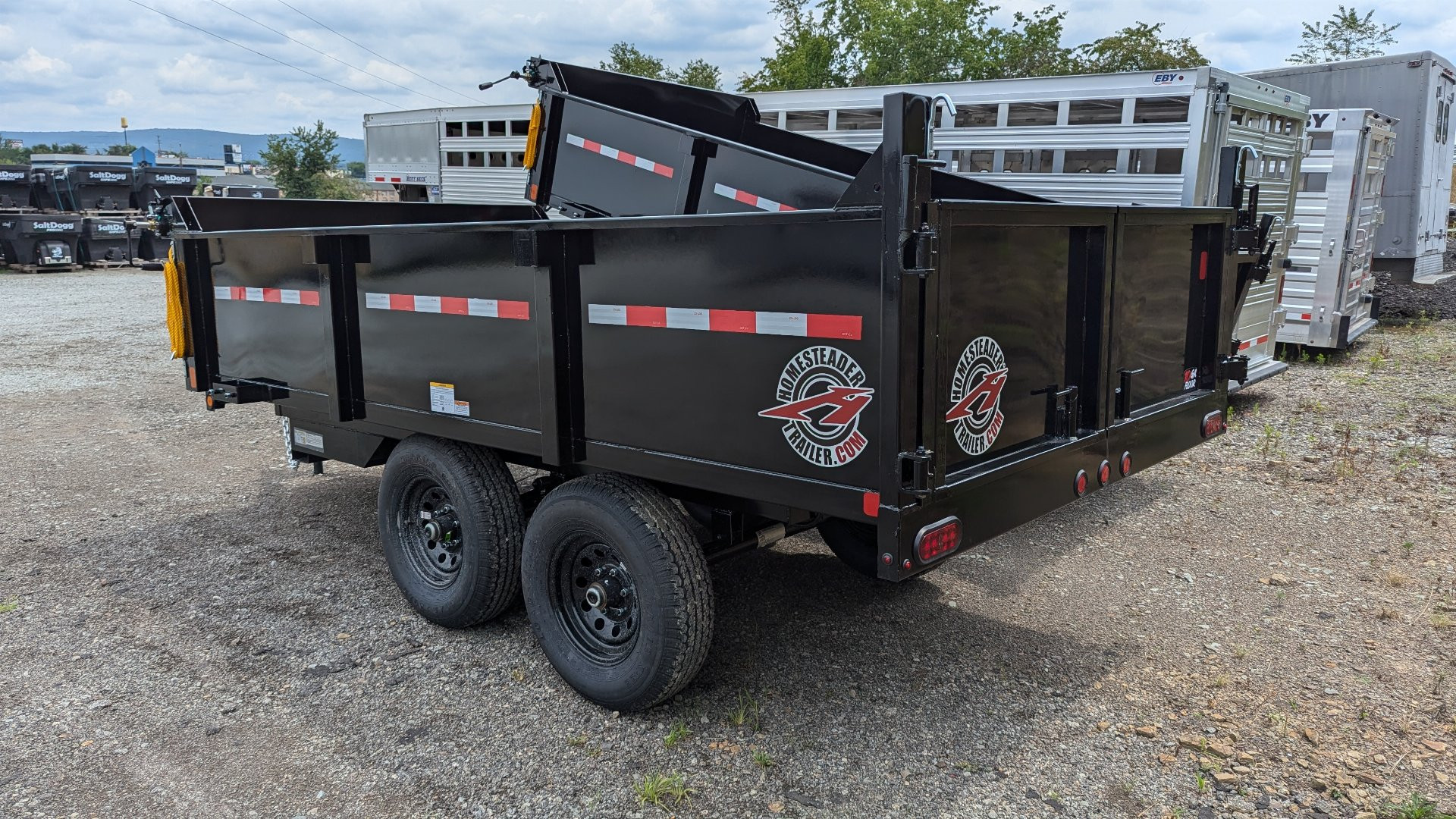 New 2025 Homesteader 6x12 Deckover Dump Trailer w/ Dropside on Curbside