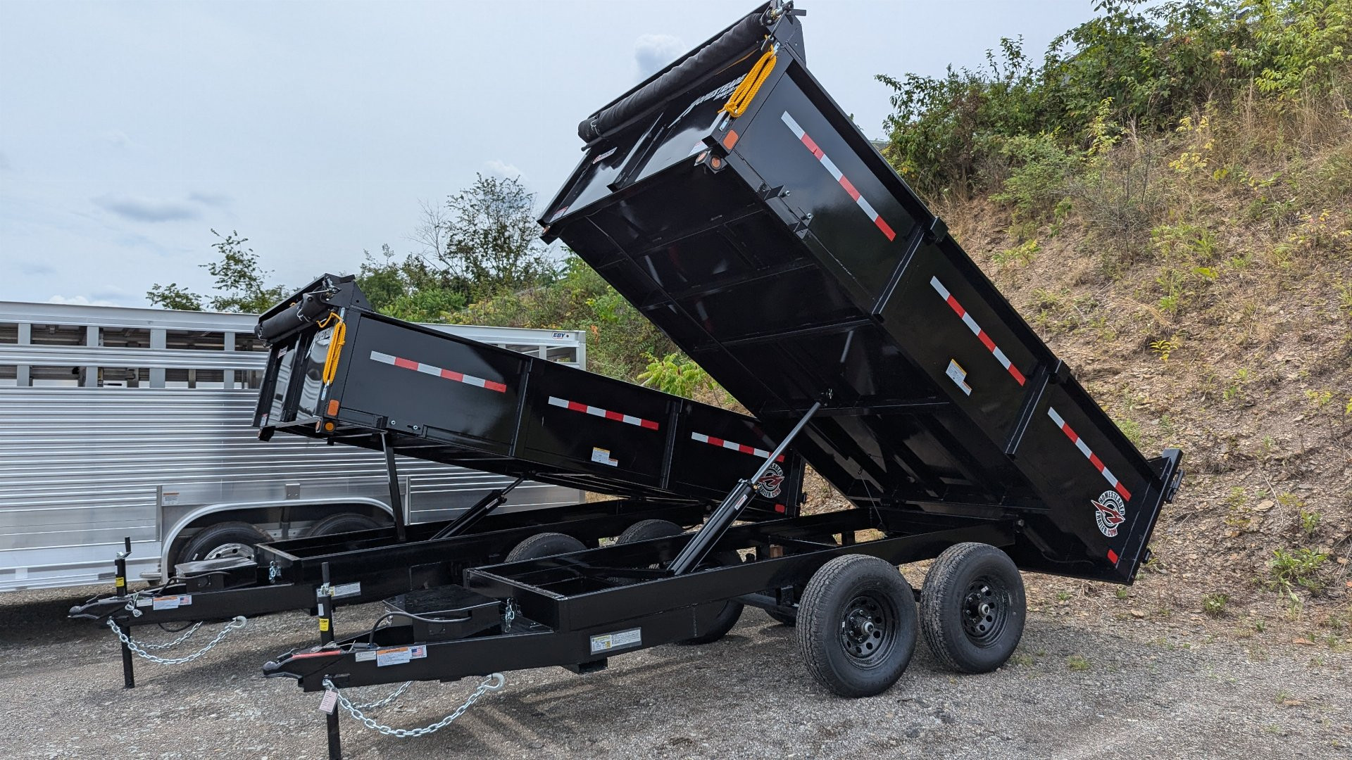 New 2025 Homesteader 6x12 Deckover Dump Trailer w/ Dropside on Curbside