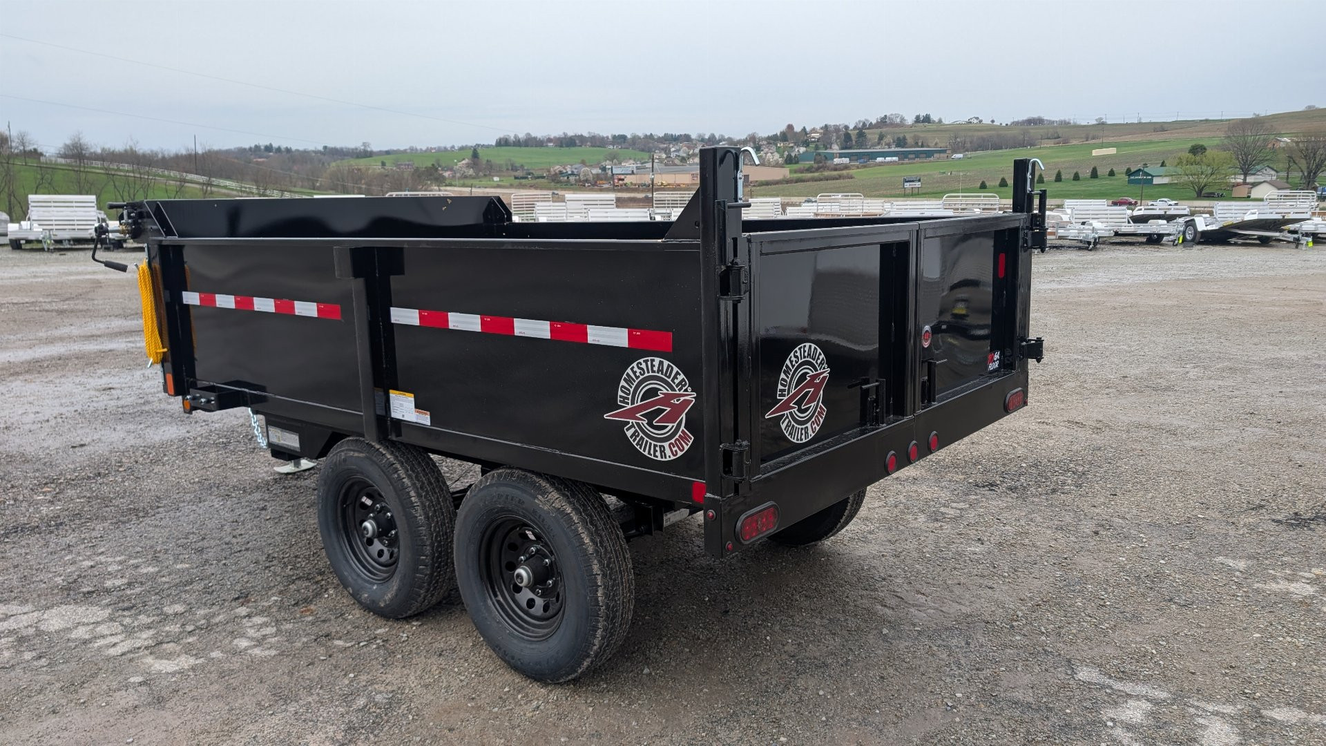 New 2025 Homesteader 6x10 Deckover Dump Trailer w/ Dropside on Curbside & Barn Doors