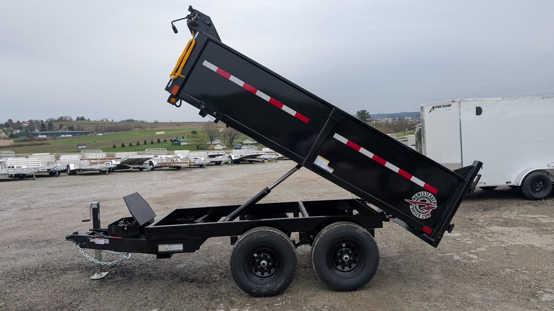 New 2025 Homesteader 6x10 Deckover Dump Trailer w/ Dropside on Curbside & Barn Doors