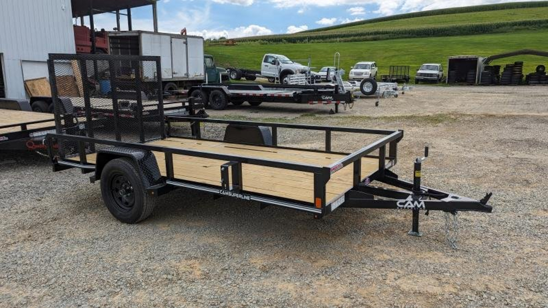 New 2025 CAM SUPERLINE 7x12 Tubular Top Rail Utility Trailer w/ Spring Assist/ Lay Down Ramp