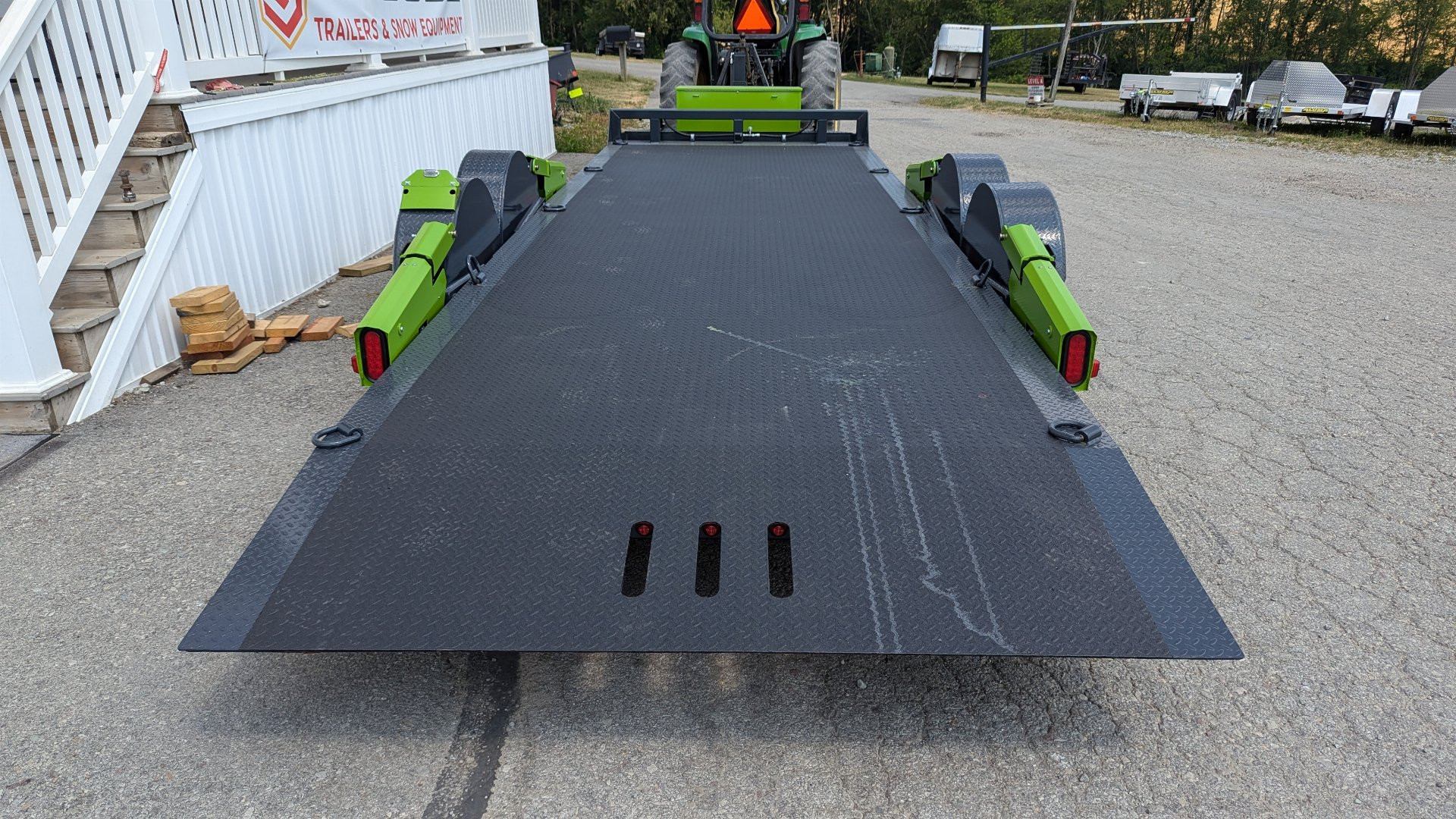 New 2025 FlatTrak by Belmont 7x22 HD Lay Flat Tilt Equipment Hauler w/ Hydraulic Jack