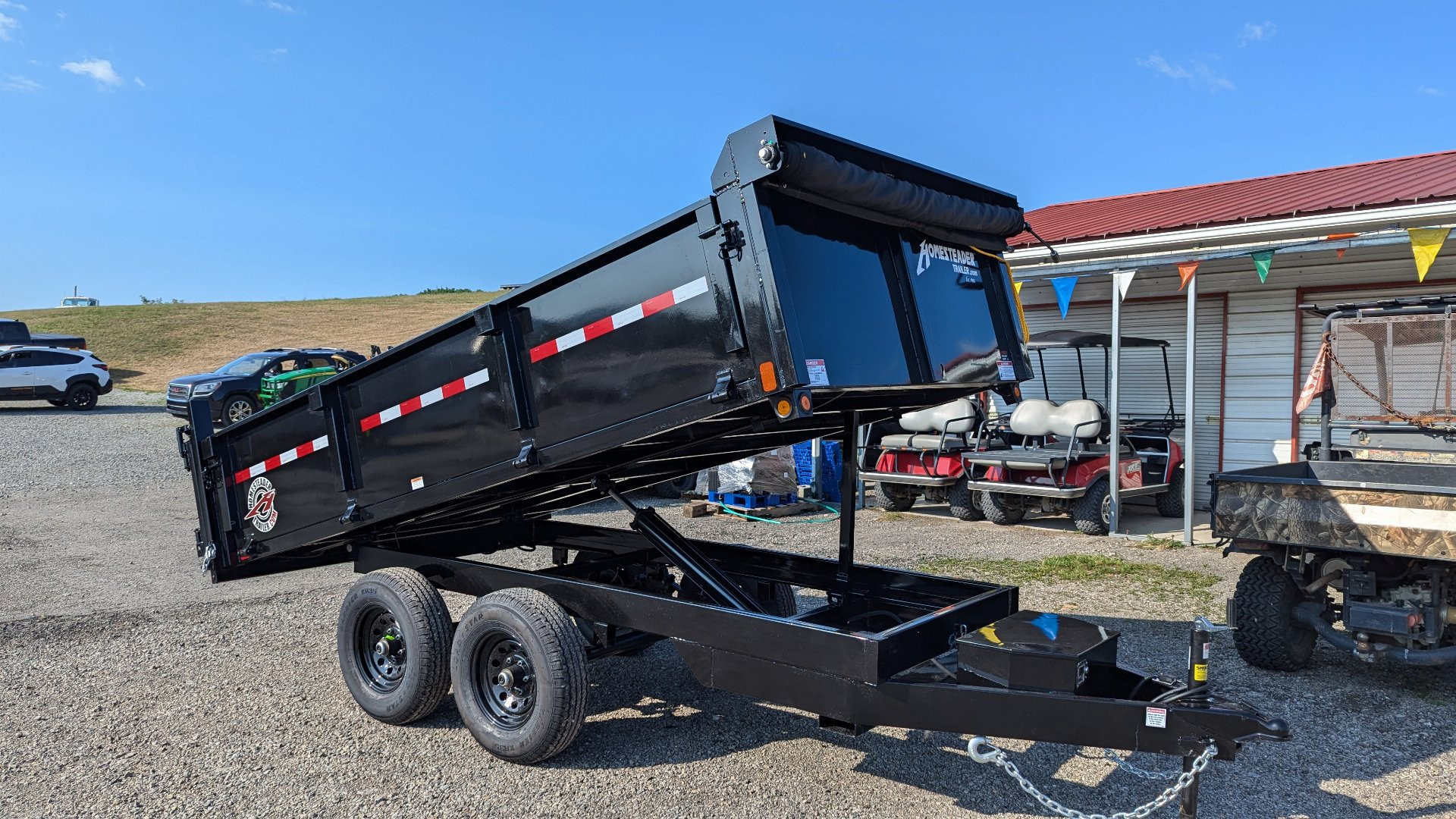 New 2025 Homesteader 6x12 Deckover Dump Trailer w/ Dropside on Curbside & Barn/Spreader Gate