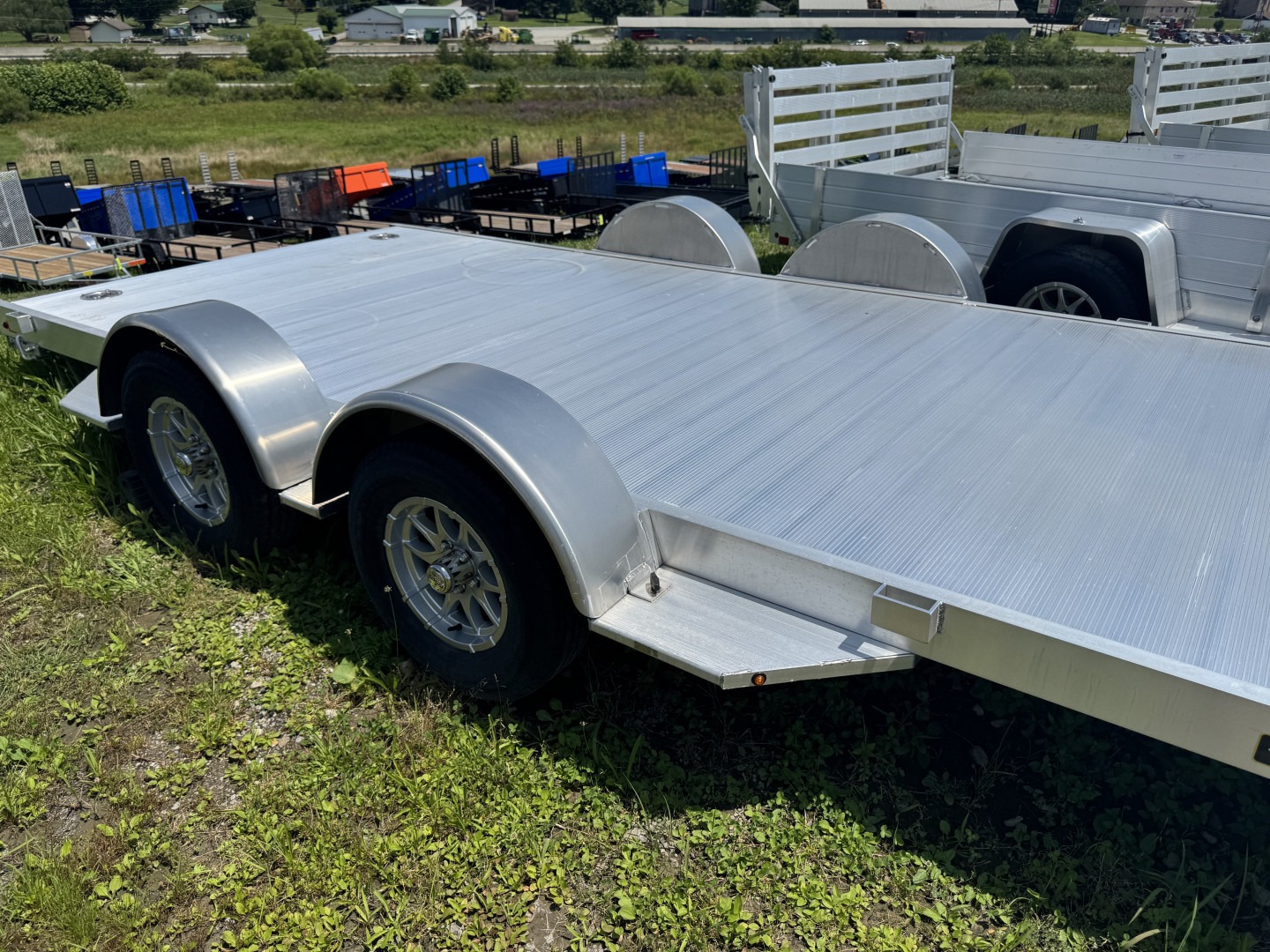 New 2025 Aluma 6'10" x 18' Utility Trailer w/ Dove Tail & Underbody Ramps (LEFTOVER PRICING!!!)