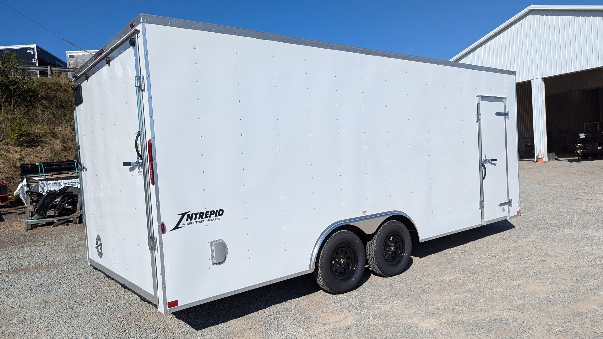 New 2025 Homesteader 8.5 x 20 Intrepid V-Nose Car Hauler w/ Ramp Door