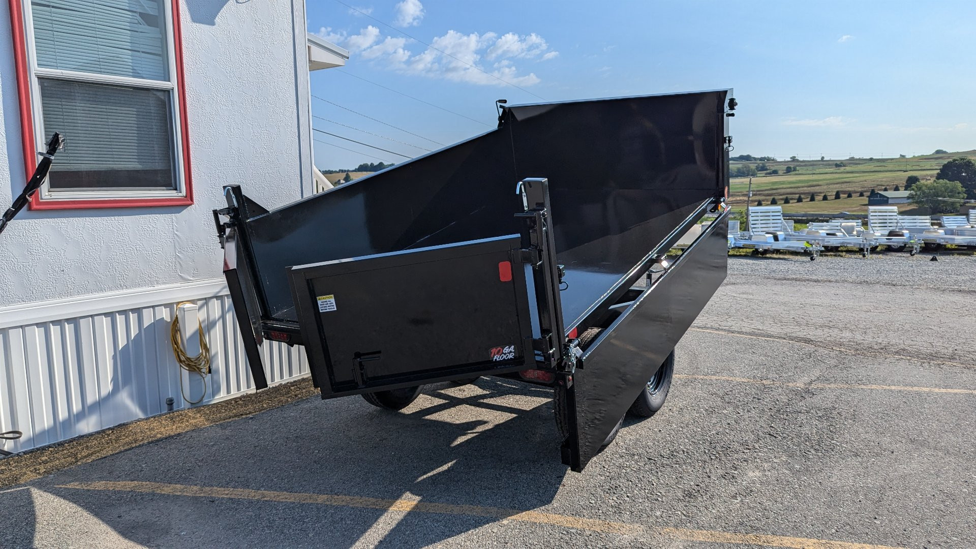 New 2025 Homesteader 6x10 Deckover Dump Trailer w/ Dropside on Curbside & Barn/Spreader Gate