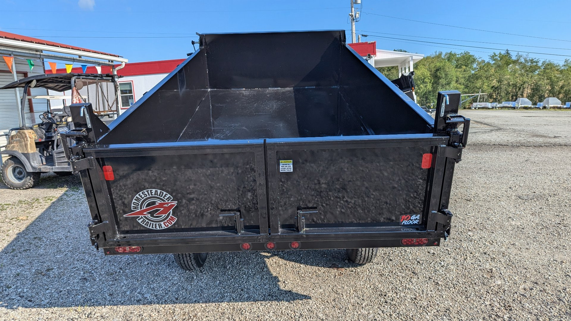 New 2025 Homesteader 6x10 Deckover Dump Trailer w/ Dropside on Curbside & Barn/Spreader Gate