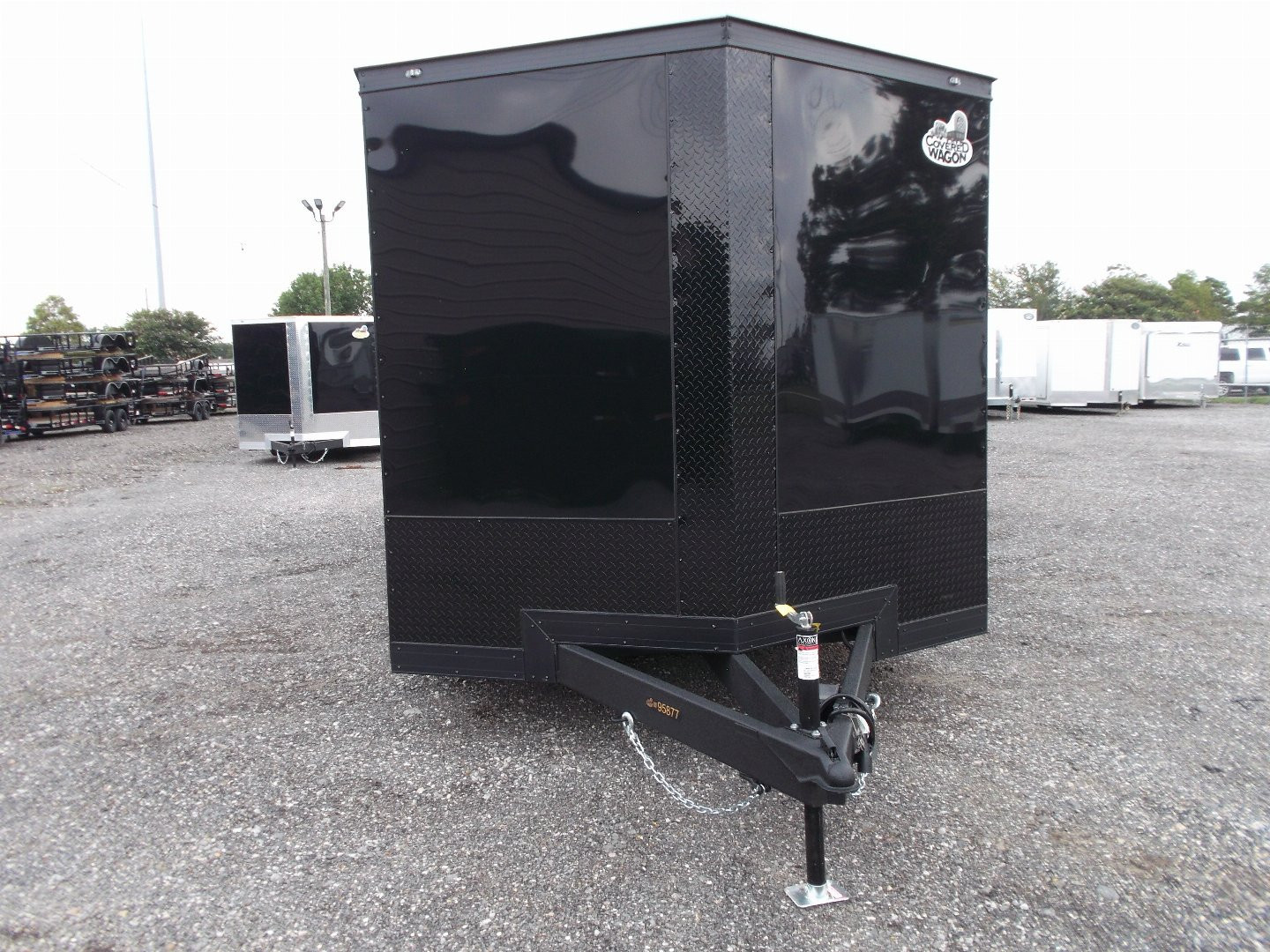 New 2025 COVERED WAGON TRAILERS 8.5x24 Cargo Trailer / Enclosed Car Hauler / 7ft Interior / 5200# Axles / Extra Wide Ramp Door / 48" RV Side Door / Bed Lined RV Step / .030 Black Semi-Screwless Exterior / Black Out Package
