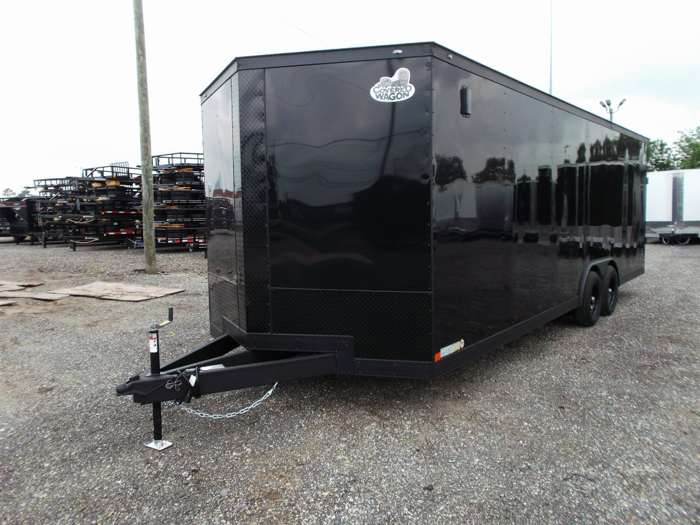 New 2025 COVERED WAGON TRAILERS 8.5x24 Cargo Trailer / Enclosed Car Hauler / 7ft Interior / 5200# Axles / Extra Wide Ramp Door / 48" RV Side Door / Bed Lined RV Step / .030 Black Semi-Screwless Exterior / Black Out Package