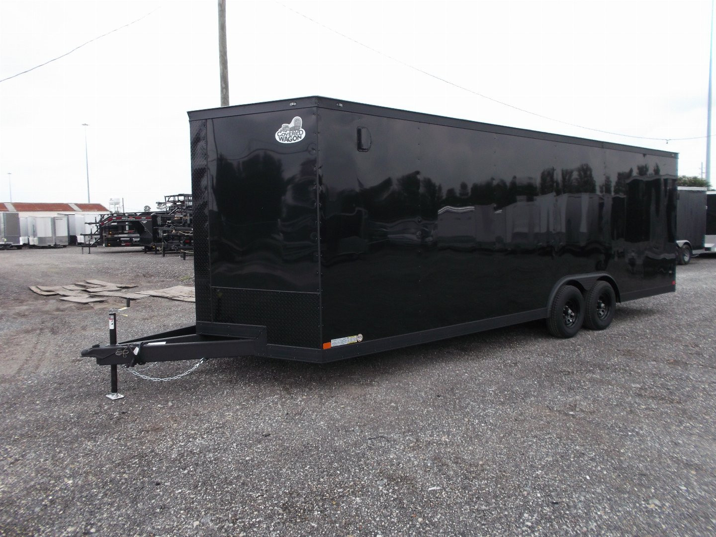 New 2025 COVERED WAGON TRAILERS 8.5x24 Cargo Trailer / Enclosed Car Hauler / 7ft Interior / 5200# Axles / Extra Wide Ramp Door / 48" RV Side Door / Bed Lined RV Step / .030 Black Semi-Screwless Exterior / Black Out Package