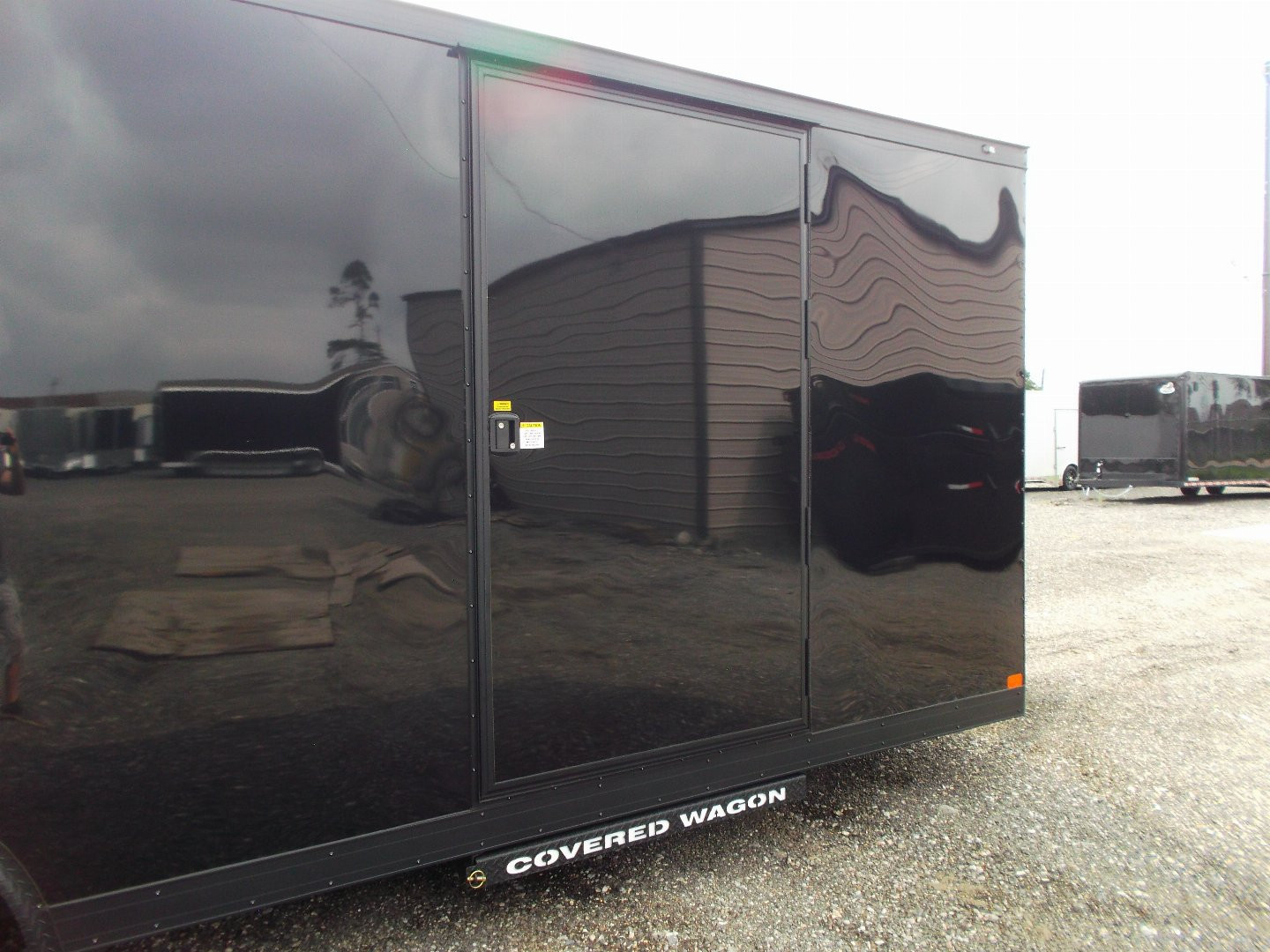 New 2025 COVERED WAGON TRAILERS 8.5x24 Cargo Trailer / Enclosed Car Hauler / 7ft Interior / 5200# Axles / Extra Wide Ramp Door / 48" RV Side Door / Bed Lined RV Step / .030 Black Semi-Screwless Exterior / Black Out Package