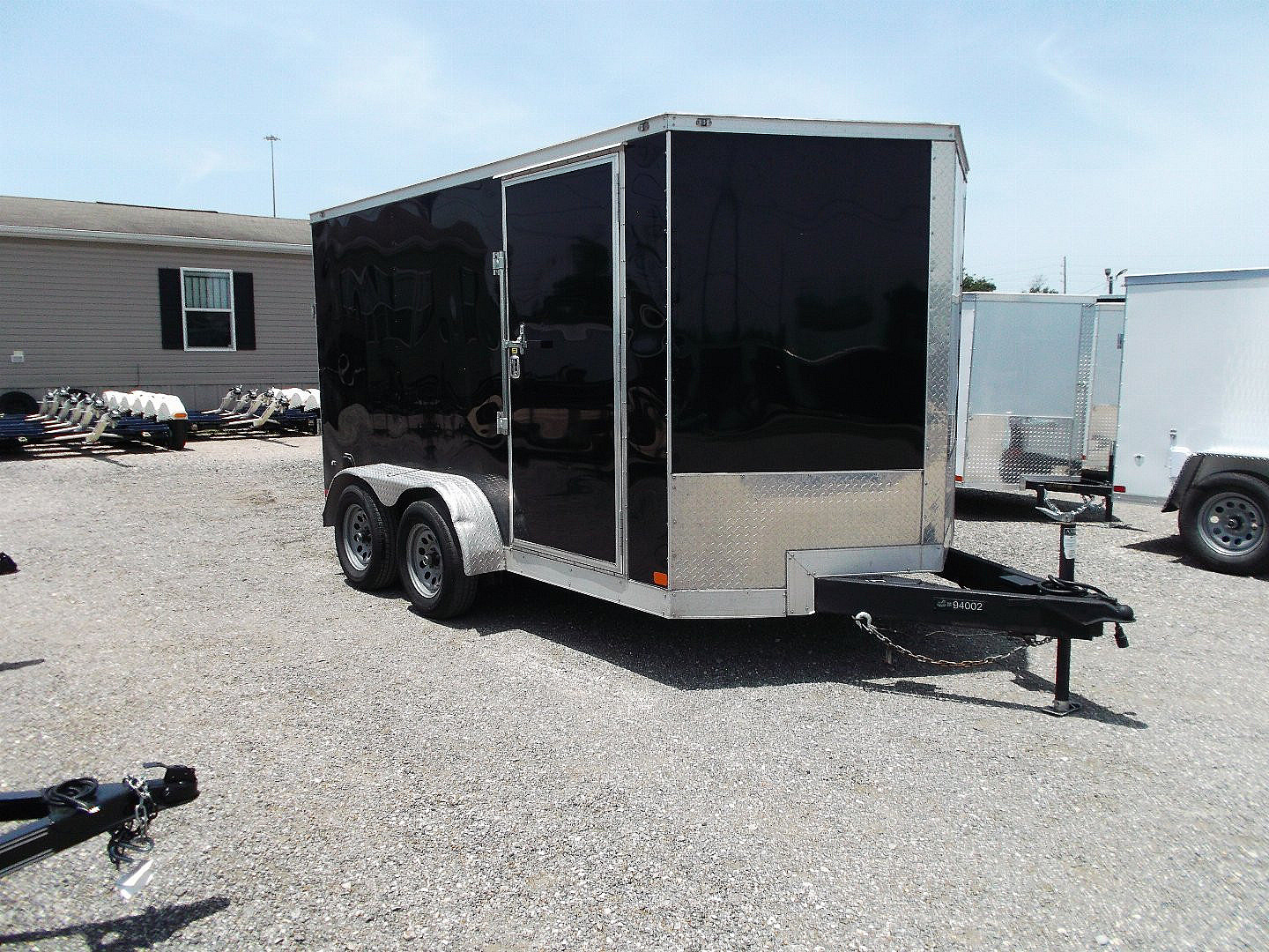 Used 2024 COVERED WAGON TRAILERS 7x12 TA Cargo Trailer / Enclosed Trailer / 6'6  Interior / Extra Wide Ramp / 36  RV Door / .030 Black Semi-Screwless Exterior / (8) D-Rings