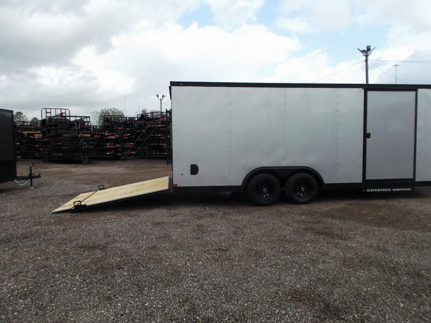 New 2025 Covered Wagon Trailers 8.5x24 Cargo / Enclosed Trailer / Race Trailer / 7ft Interior / 5200# Axles / Black Out Package / Silver .030 Semi- Screwless Exterior / Extra Wide Ramp / 48" RV Side Door / RV Step
