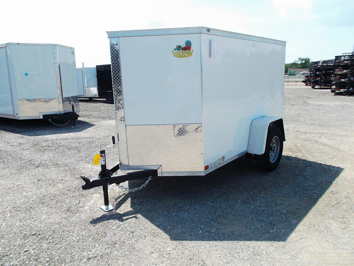 New 2025 COVERED WAGON TRAILERS 5x8 Cargo Trailer / Enclosed Cargo Trailer / Ramp / RV Side Door / Bed Lined Tongue and Frame / .030 White Semi-Screwless Exterior