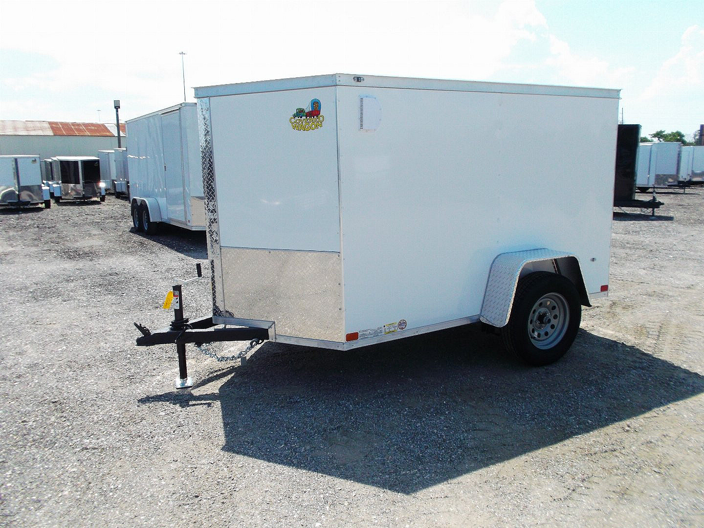 New 2025 COVERED WAGON TRAILERS 5x8 Cargo Trailer / Enclosed Cargo Trailer / Ramp / RV Side Door / Bed Lined Tongue and Frame / .030 White Semi-Screwless Exterior