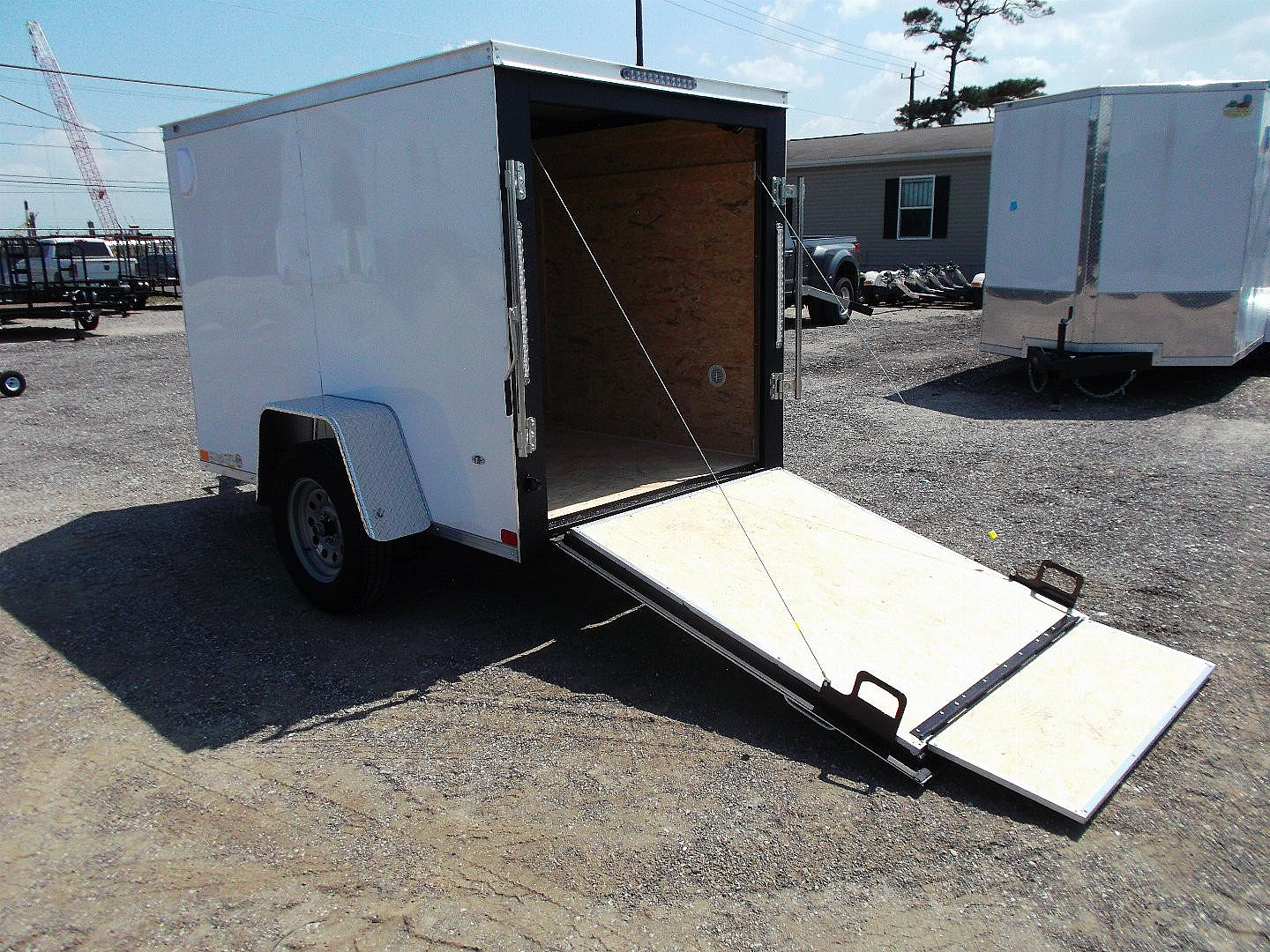 New 2025 COVERED WAGON TRAILERS 5x8 Cargo Trailer / Enclosed Cargo Trailer / Ramp / RV Side Door / Bed Lined Tongue and Frame / .030 White Semi-Screwless Exterior