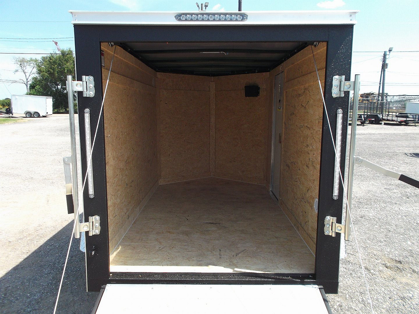 New 2025 COVERED WAGON TRAILERS 5x8 Cargo Trailer / Enclosed Cargo Trailer / Ramp / RV Side Door / Bed Lined Tongue and Frame / .030 White Semi-Screwless Exterior