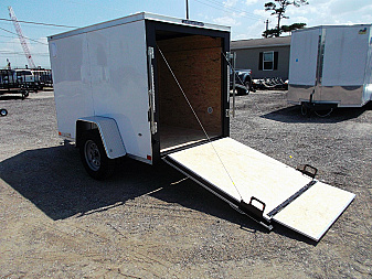 New 2025 COVERED WAGON TRAILERS 5x8 Cargo Trailer / Enclosed Cargo Trailer / Ramp / RV Side Door / Bed Lined Tongue and Frame / .030 White Semi-Screwless Exterior