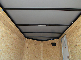 New 2025 COVERED WAGON TRAILERS 5x8 Cargo Trailer / Enclosed Cargo Trailer / Ramp / RV Side Door / Bed Lined Tongue and Frame / .030 White Semi-Screwless Exterior
