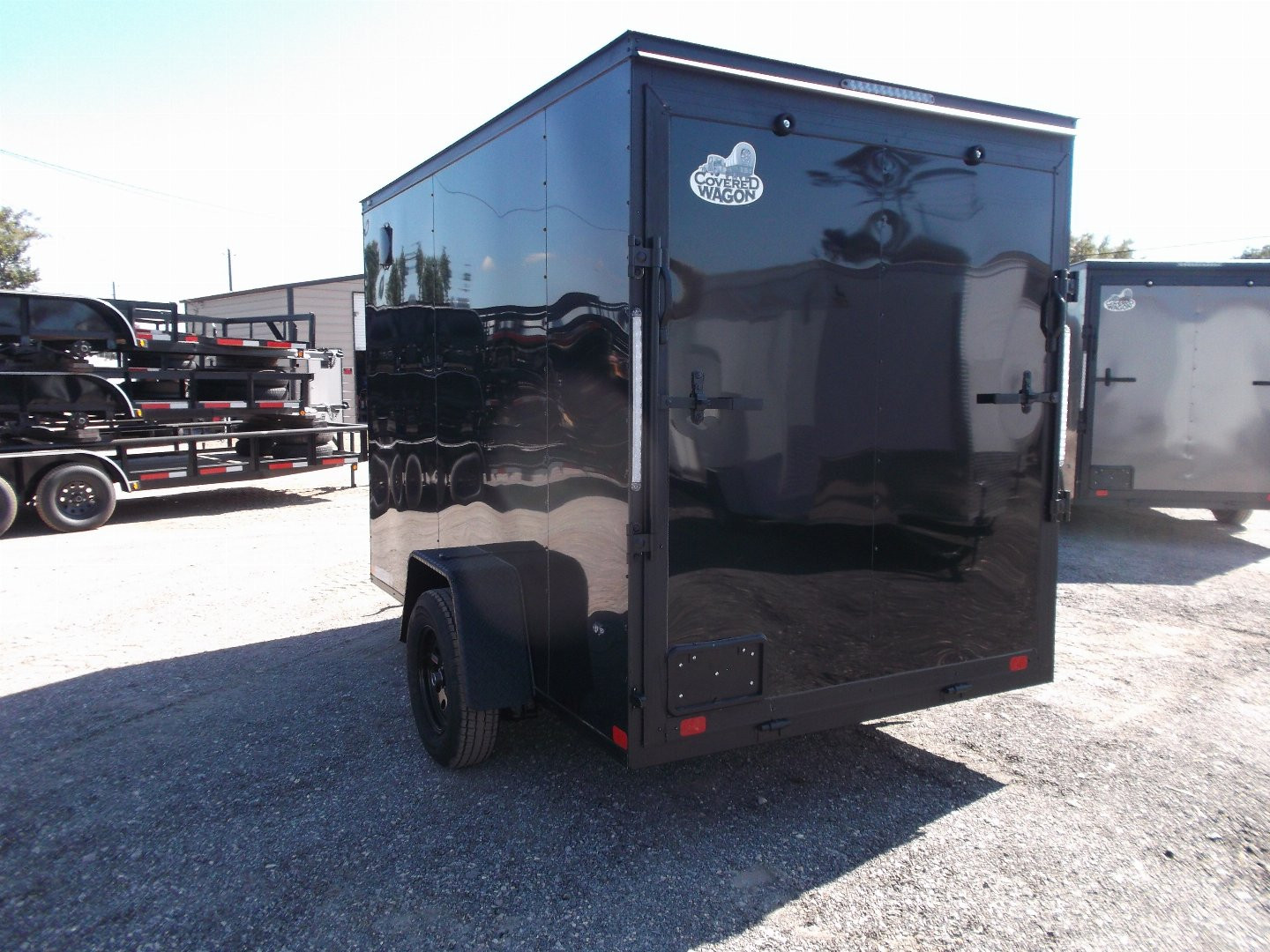 New 2025 COVERED WAGON TRAILERS 6x10 Single Axle Cargo / Enclosed Trailer / 6'6" Interior Height / Extra Wide Ramp Gate / RV Side Door / LEDs / .030 Black Semi-Screwless Exterior / Black Out Package