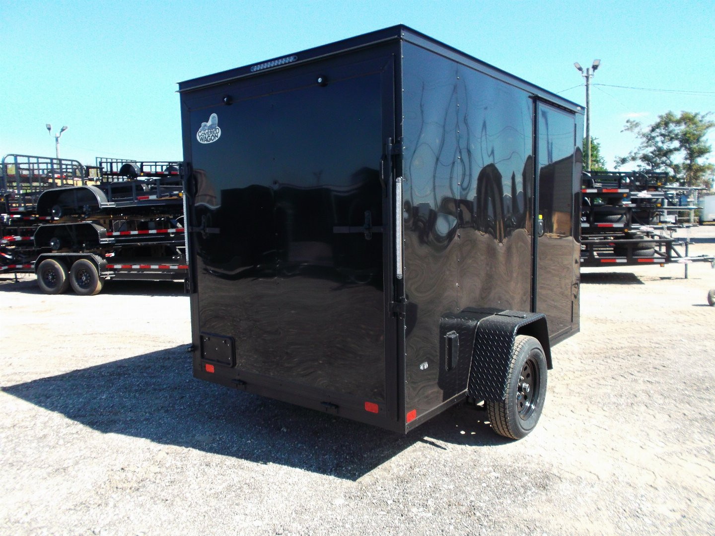New 2025 COVERED WAGON TRAILERS 6x10 Single Axle Cargo / Enclosed Trailer / 6'6" Interior Height / Extra Wide Ramp Gate / RV Side Door / LEDs / .030 Black Semi-Screwless Exterior / Black Out Package