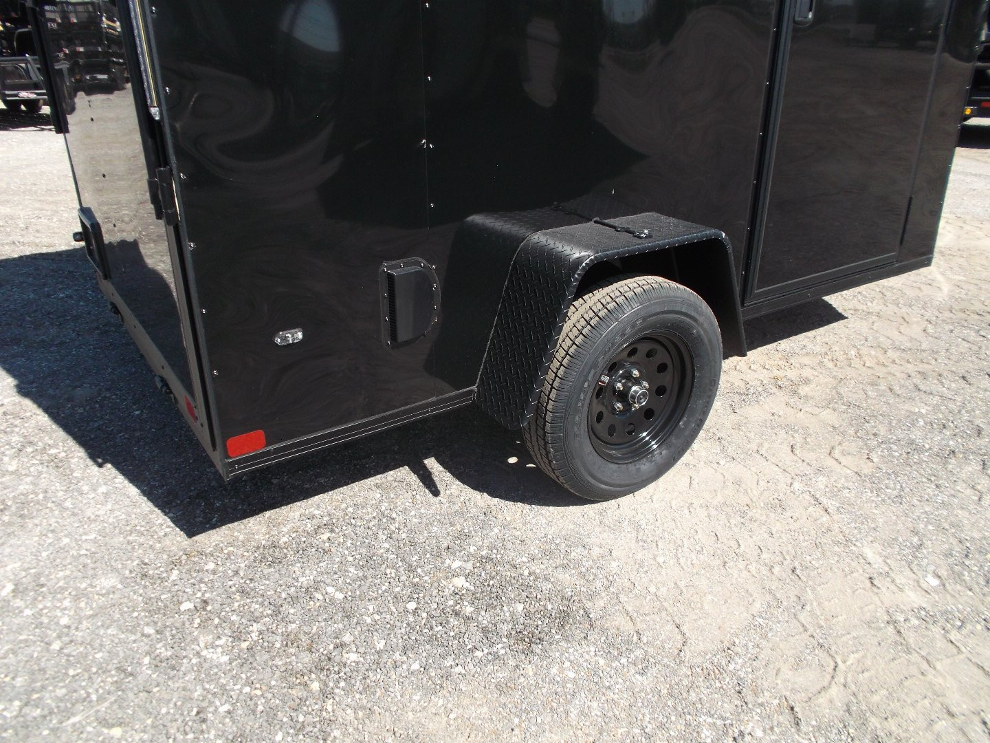 New 2025 COVERED WAGON TRAILERS 6x10 Single Axle Cargo / Enclosed Trailer / 6'6" Interior Height / Extra Wide Ramp Gate / RV Side Door / LEDs / .030 Black Semi-Screwless Exterior / Black Out Package