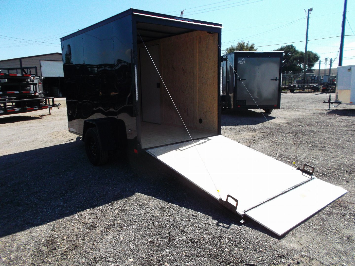 New 2025 COVERED WAGON TRAILERS 6x10 Single Axle Cargo / Enclosed Trailer / 6'6" Interior Height / Extra Wide Ramp Gate / RV Side Door / LEDs / .030 Black Semi-Screwless Exterior / Black Out Package