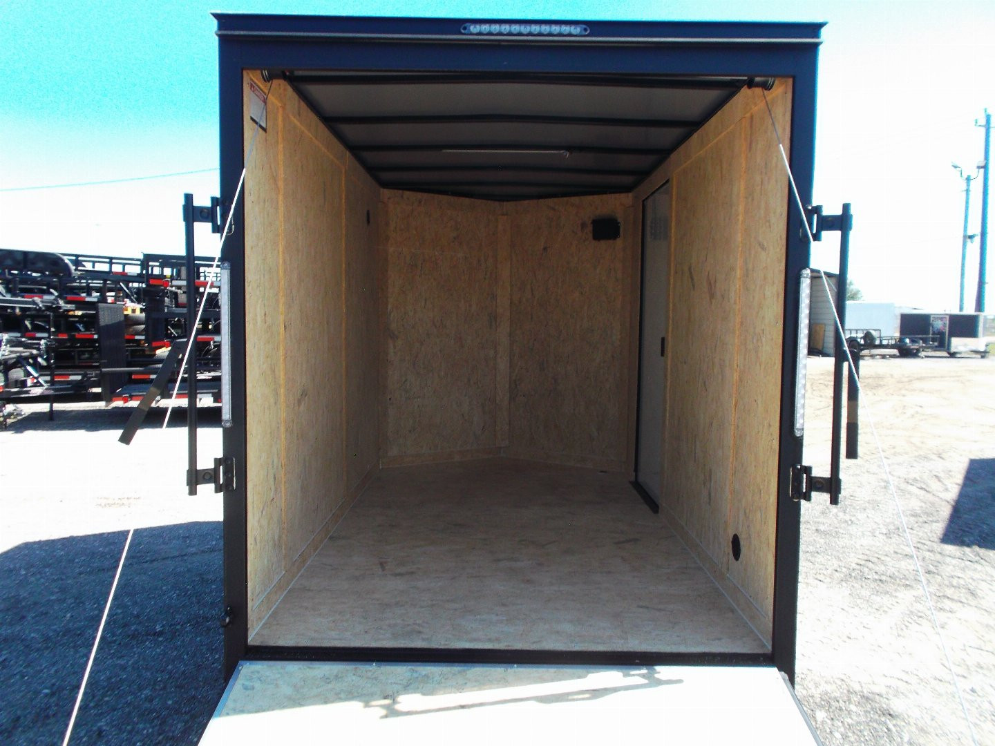 New 2025 COVERED WAGON TRAILERS 6x10 Single Axle Cargo / Enclosed Trailer / 6'6" Interior Height / Extra Wide Ramp Gate / RV Side Door / LEDs / .030 Black Semi-Screwless Exterior / Black Out Package