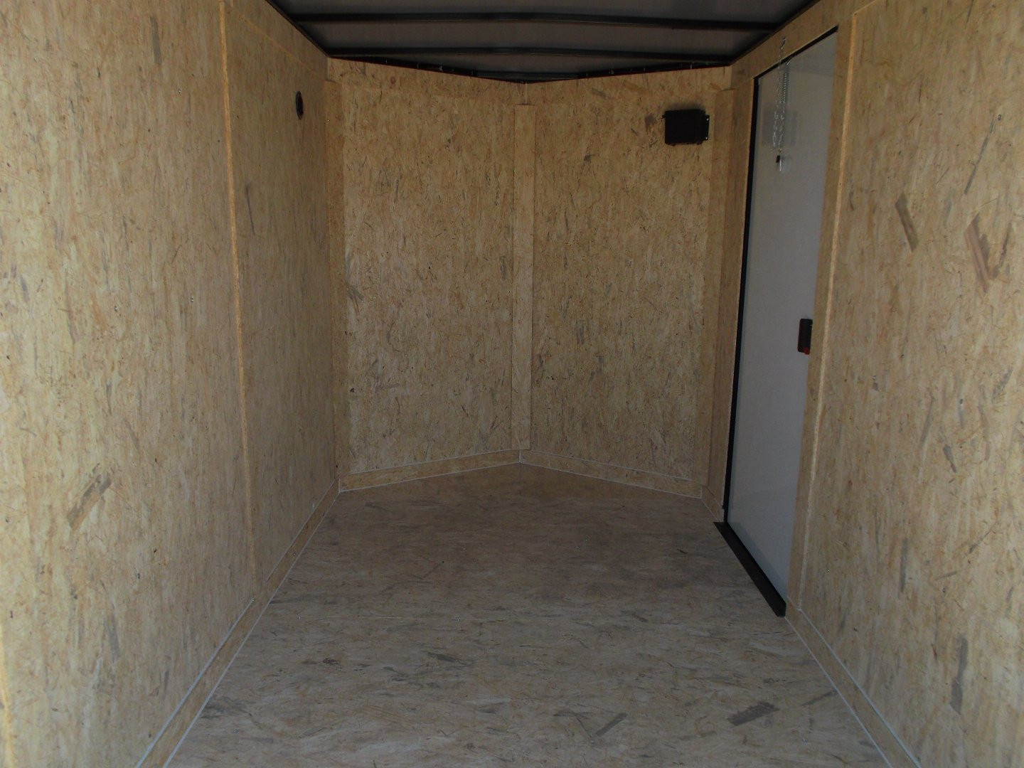 New 2025 COVERED WAGON TRAILERS 6x10 Single Axle Cargo / Enclosed Trailer / 6'6" Interior Height / Extra Wide Ramp Gate / RV Side Door / LEDs / .030 Black Semi-Screwless Exterior / Black Out Package