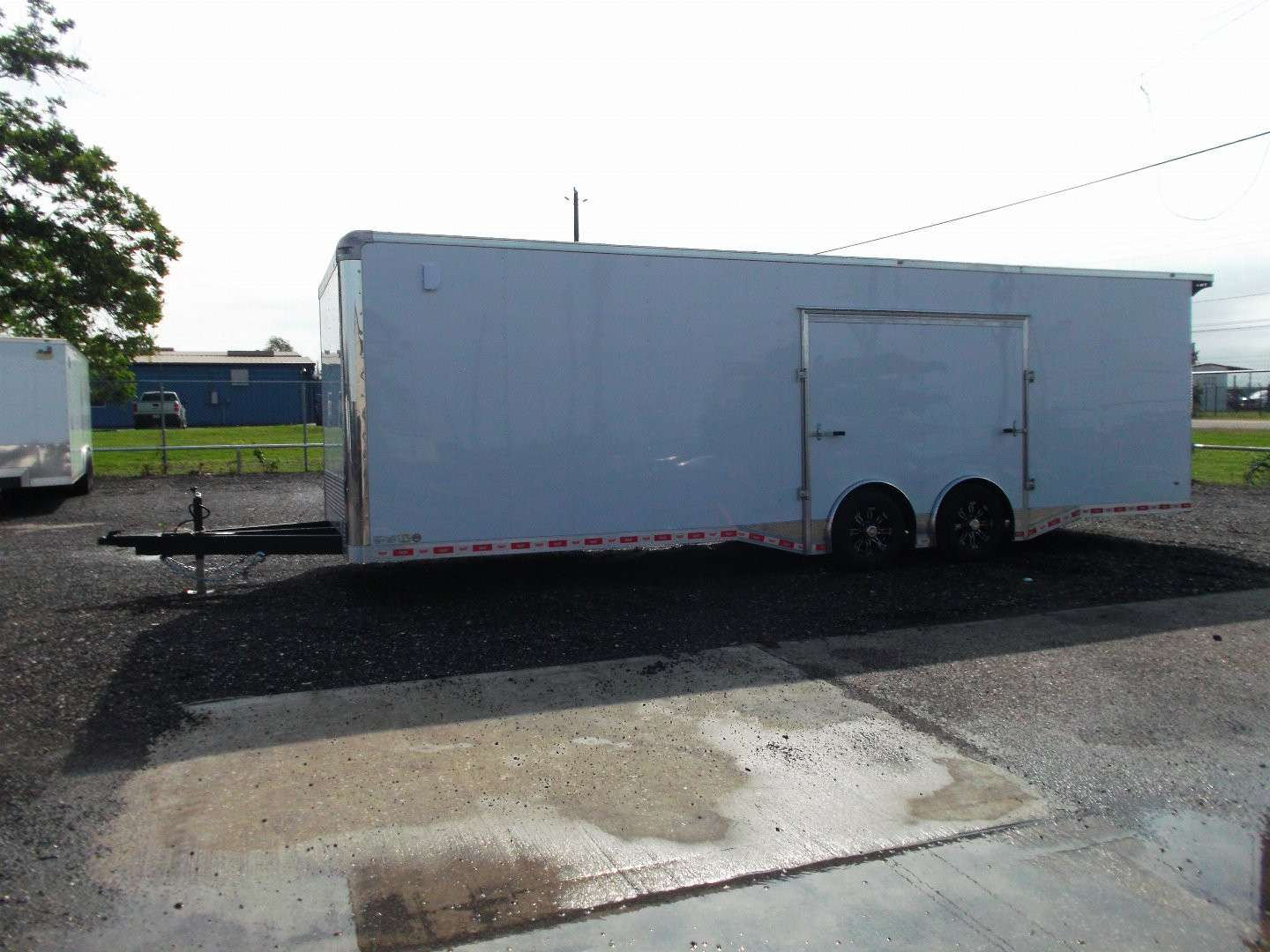 New 2025 COVERED WAGON 8.5x28 Enclosed Race Trailer / Cargo Trailer / XXL Package / 7'6" Interior Height / Split 7000# Torsion Axles / Heavy Duty Extra Wide Ramp / .080 White Poly Core Exterior / Mag Wheels / Rear Spoiler / Side Wall Escape Door