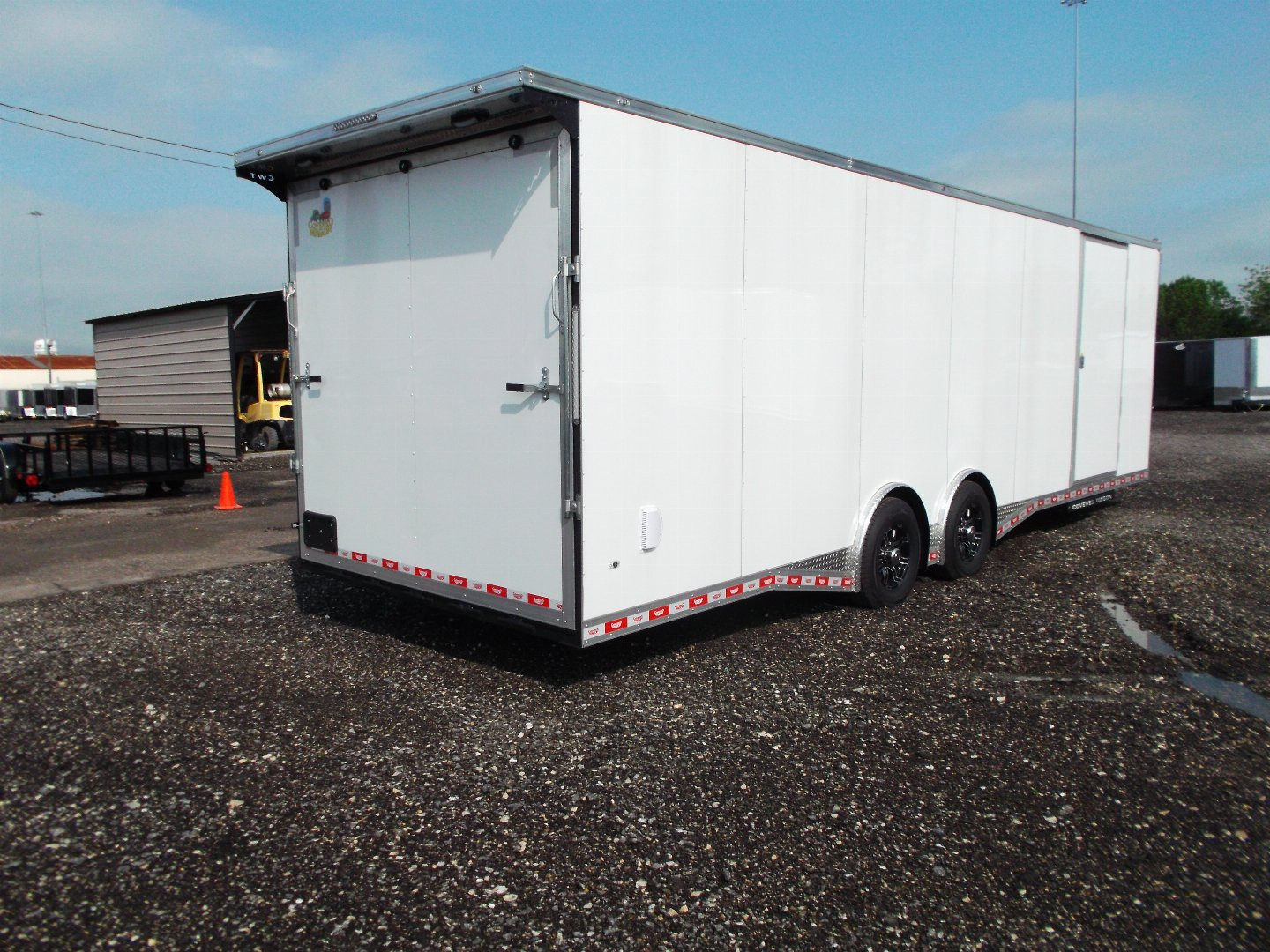 New 2025 COVERED WAGON 8.5x28 Enclosed Race Trailer / Cargo Trailer / XXL Package / 7'6" Interior Height / Split 7000# Torsion Axles / Heavy Duty Extra Wide Ramp / .080 White Poly Core Exterior / Mag Wheels / Rear Spoiler / Side Wall Escape Door