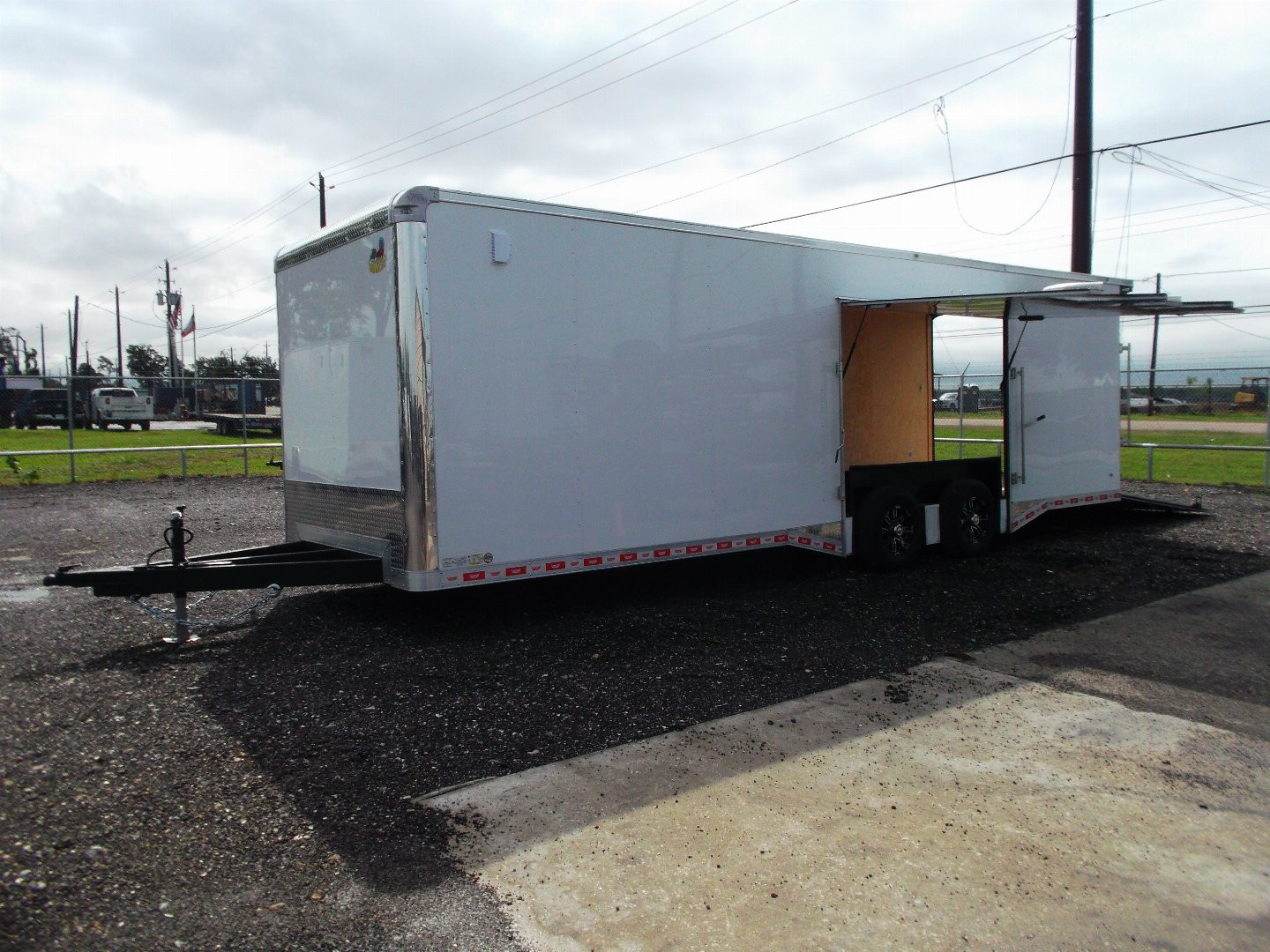 New 2025 COVERED WAGON 8.5x28 Enclosed Race Trailer / Cargo Trailer / XXL Package / 7'6" Interior Height / Split 7000# Torsion Axles / Heavy Duty Extra Wide Ramp / .080 White Poly Core Exterior / Mag Wheels / Rear Spoiler / Side Wall Escape Door