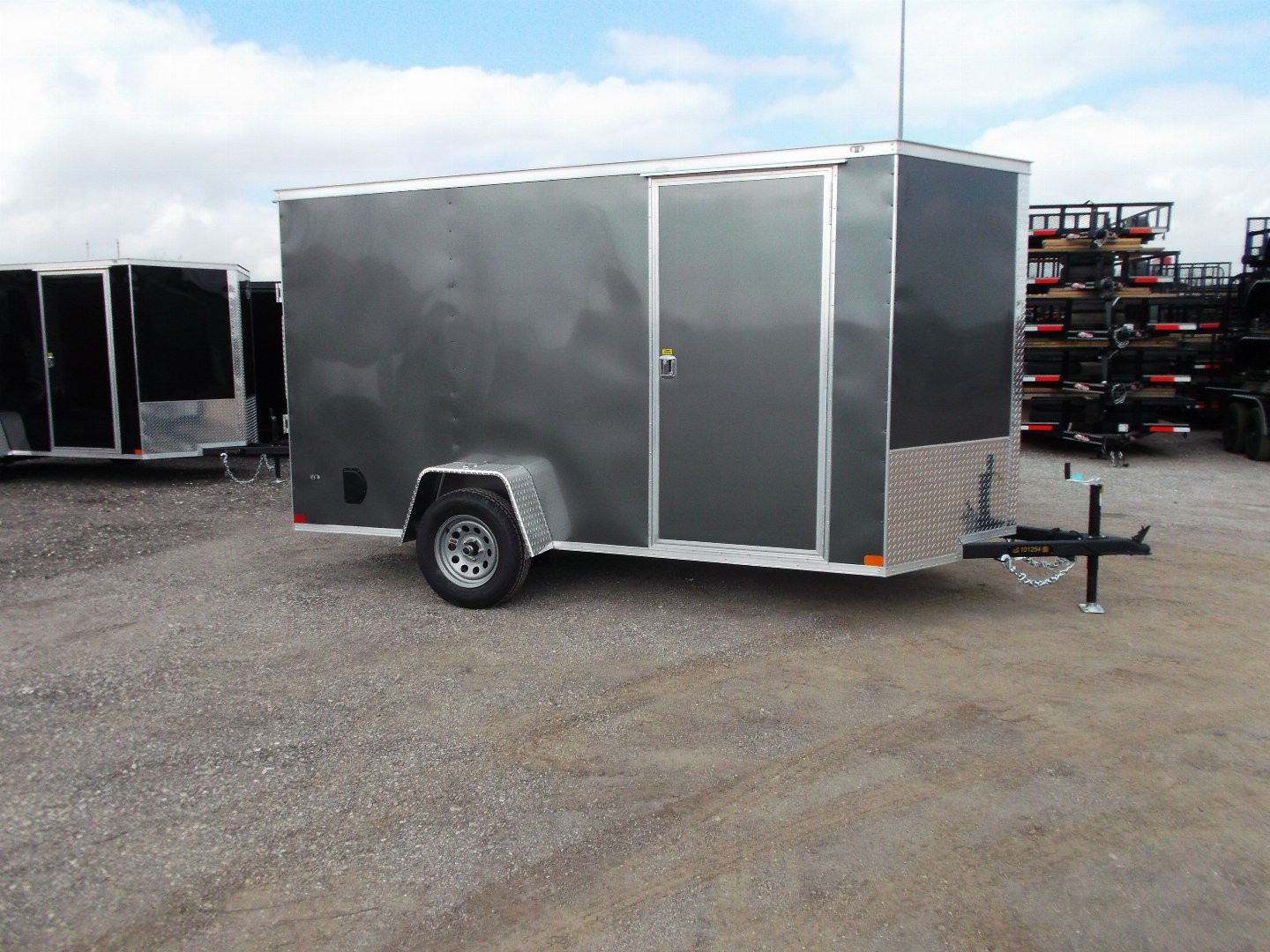 New 2025 Covered Wagon Trailers 6x12 SA Cargo Trailer / Enclosed Trailer / 6'6" Interior / 36" RV Side Door / Bed Lined Tongue and Frame / .030 Charcoal Gray Semi-Screwless Exterior / (4) D-Rings / Extra Wide Ramp