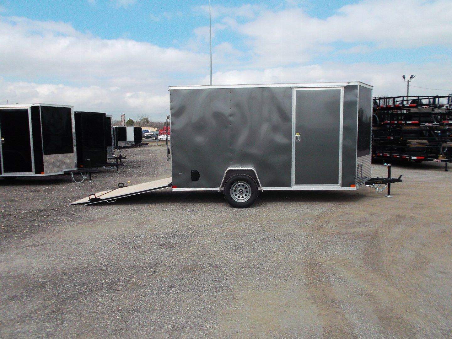 New 2025 Covered Wagon Trailers 6x12 SA Cargo Trailer / Enclosed Trailer / 6'6" Interior / 36" RV Side Door / Bed Lined Tongue and Frame / .030 Charcoal Gray Semi-Screwless Exterior / (4) D-Rings / Extra Wide Ramp