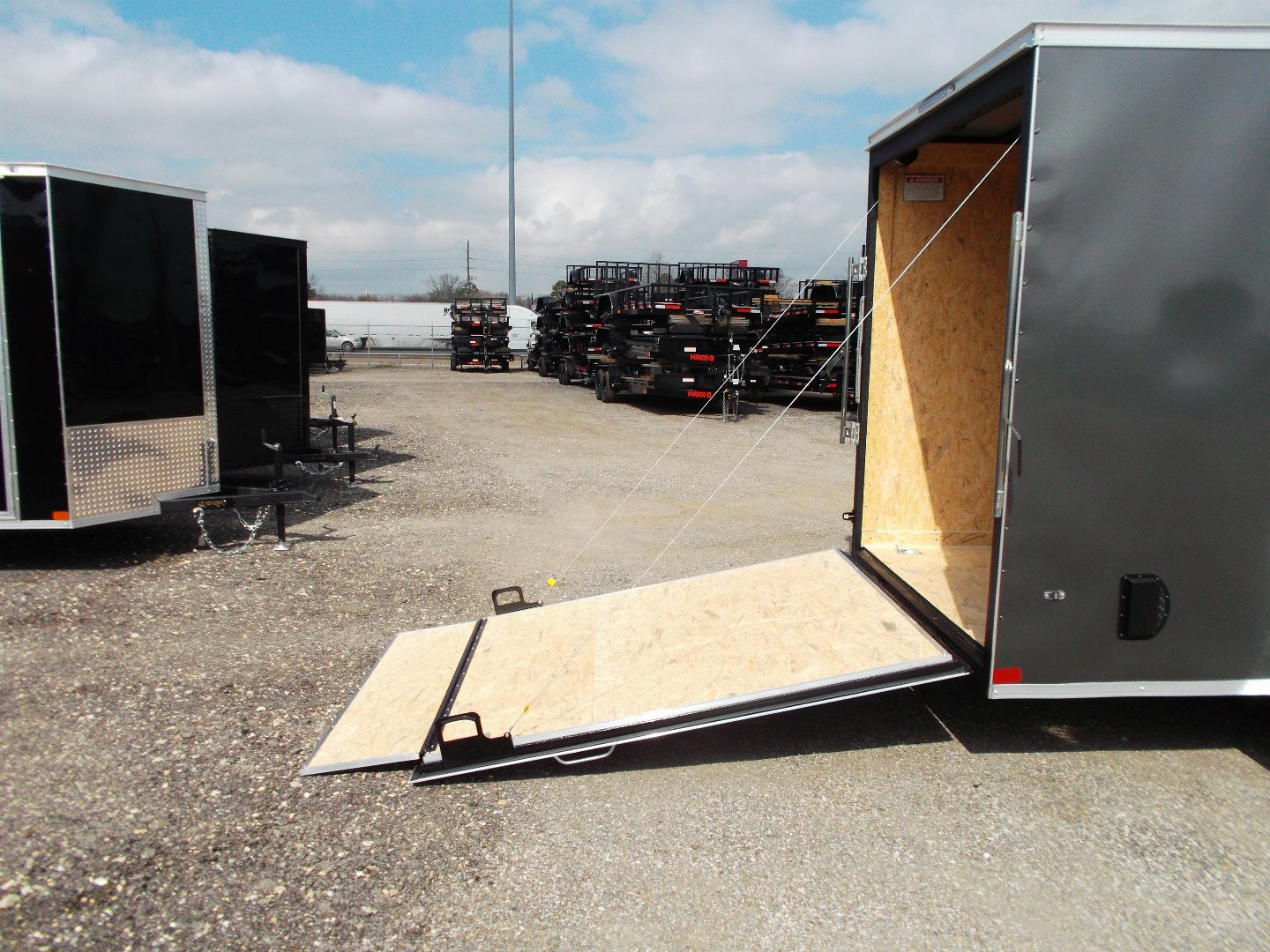 New 2025 Covered Wagon Trailers 6x12 SA Cargo Trailer / Enclosed Trailer / 6'6" Interior / 36" RV Side Door / Bed Lined Tongue and Frame / .030 Charcoal Gray Semi-Screwless Exterior / (4) D-Rings / Extra Wide Ramp