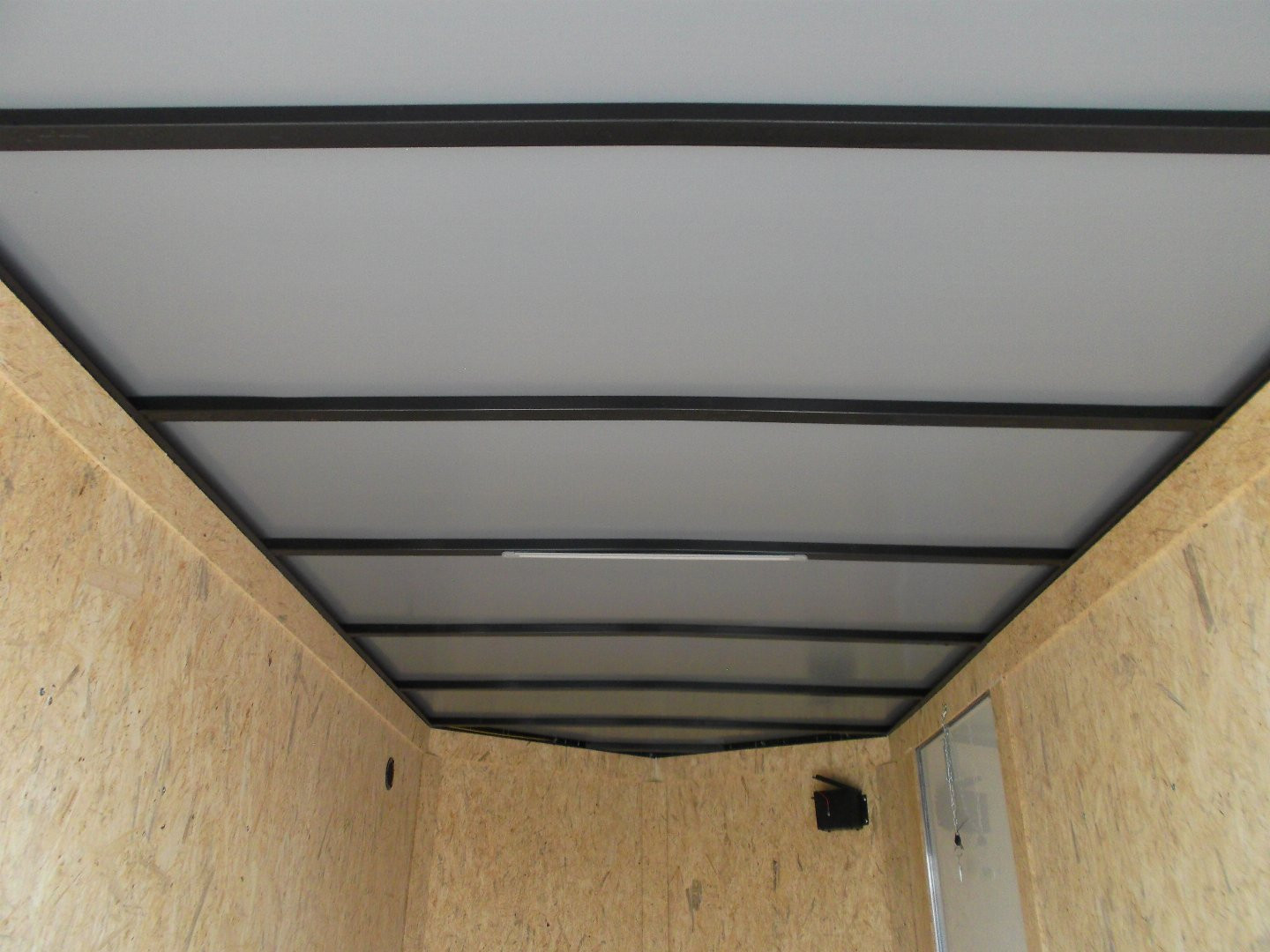 New 2025 Covered Wagon Trailers 6x12 SA Cargo Trailer / Enclosed Trailer / 6'6" Interior / 36" RV Side Door / Bed Lined Tongue and Frame / .030 Charcoal Gray Semi-Screwless Exterior / (4) D-Rings / Extra Wide Ramp