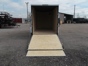 New 2025 Covered Wagon Trailers 6x12 SA Cargo Trailer / Enclosed Trailer / 6'6" Interior / 36" RV Side Door / Bed Lined Tongue and Frame / .030 Charcoal Gray Semi-Screwless Exterior / (4) D-Rings / Extra Wide Ramp