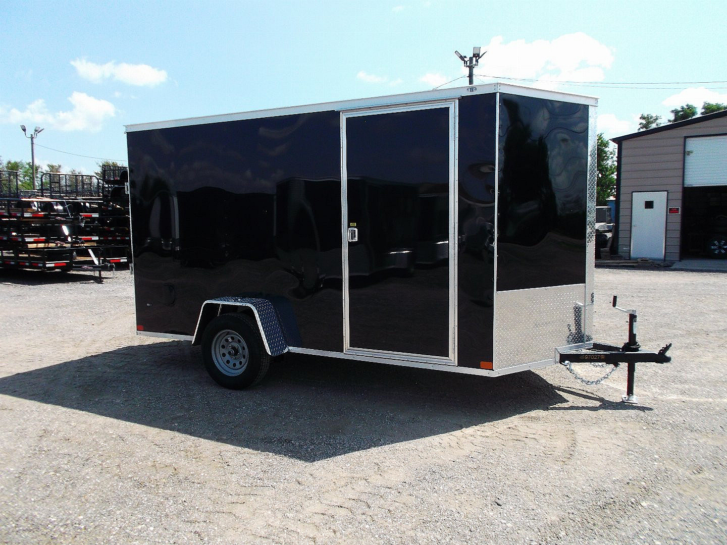 New 2025 Covered Wagon Trailers 6x12 SA Cargo / Enclosed Trailer / Extra Wide Ramp / 36" RV Side Door / 6'6" Interior / Bed Lined Tongue and Frame / (4) D-Rings / .030 Black Semi-Screwless Exterior
