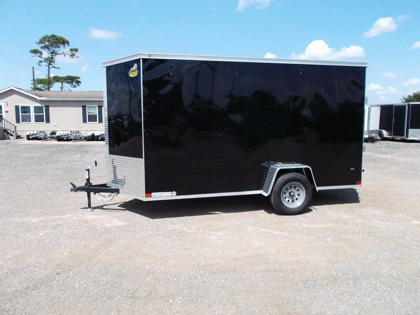New 2025 Covered Wagon Trailers 6x12 SA Cargo / Enclosed Trailer / Extra Wide Ramp / 36" RV Side Door / 6'6" Interior / Bed Lined Tongue and Frame / (4) D-Rings / .030 Black Semi-Screwless Exterior