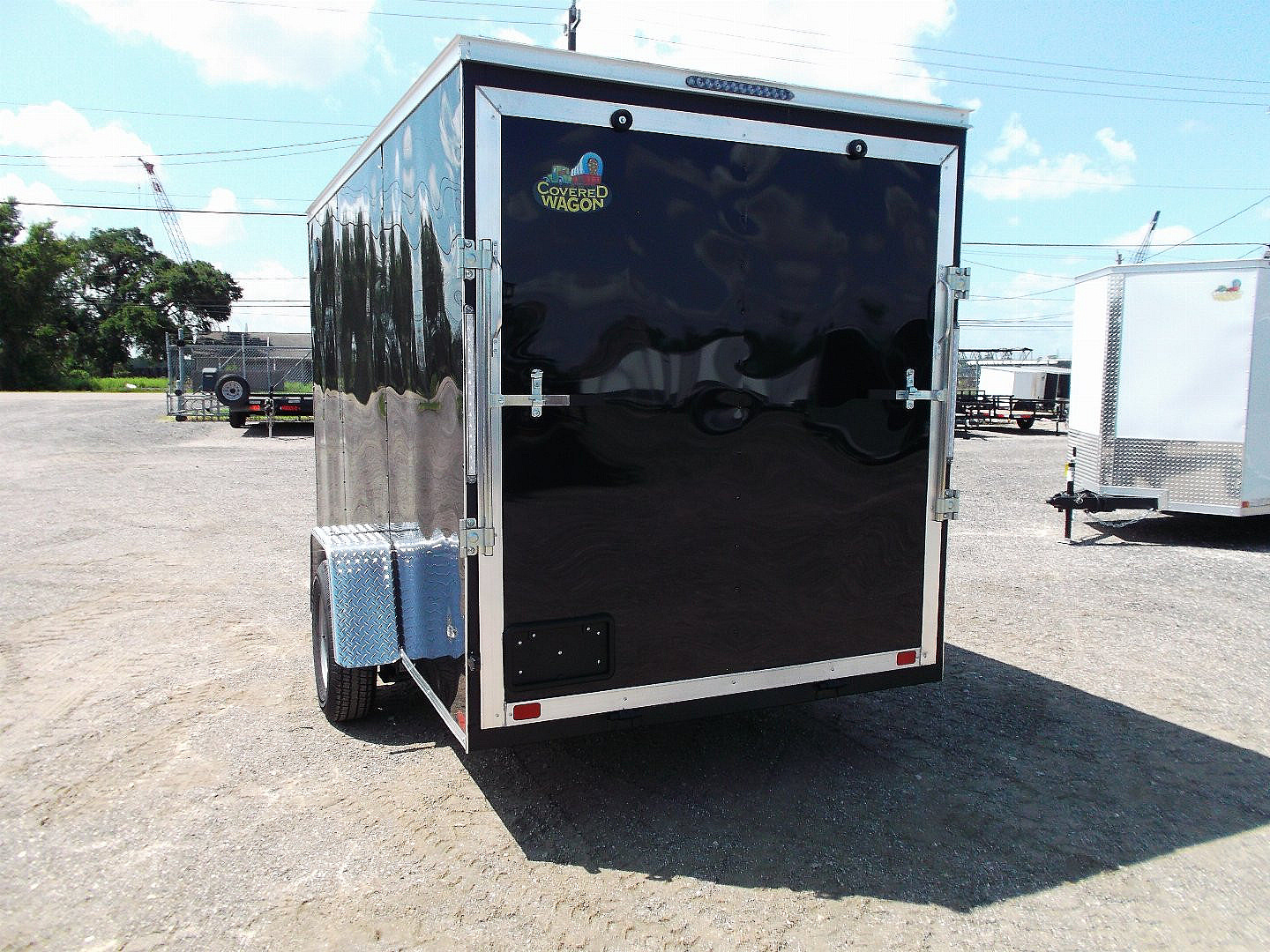 New 2025 Covered Wagon Trailers 6x12 SA Cargo / Enclosed Trailer / Extra Wide Ramp / 36" RV Side Door / 6'6" Interior / Bed Lined Tongue and Frame / (4) D-Rings / .030 Black Semi-Screwless Exterior