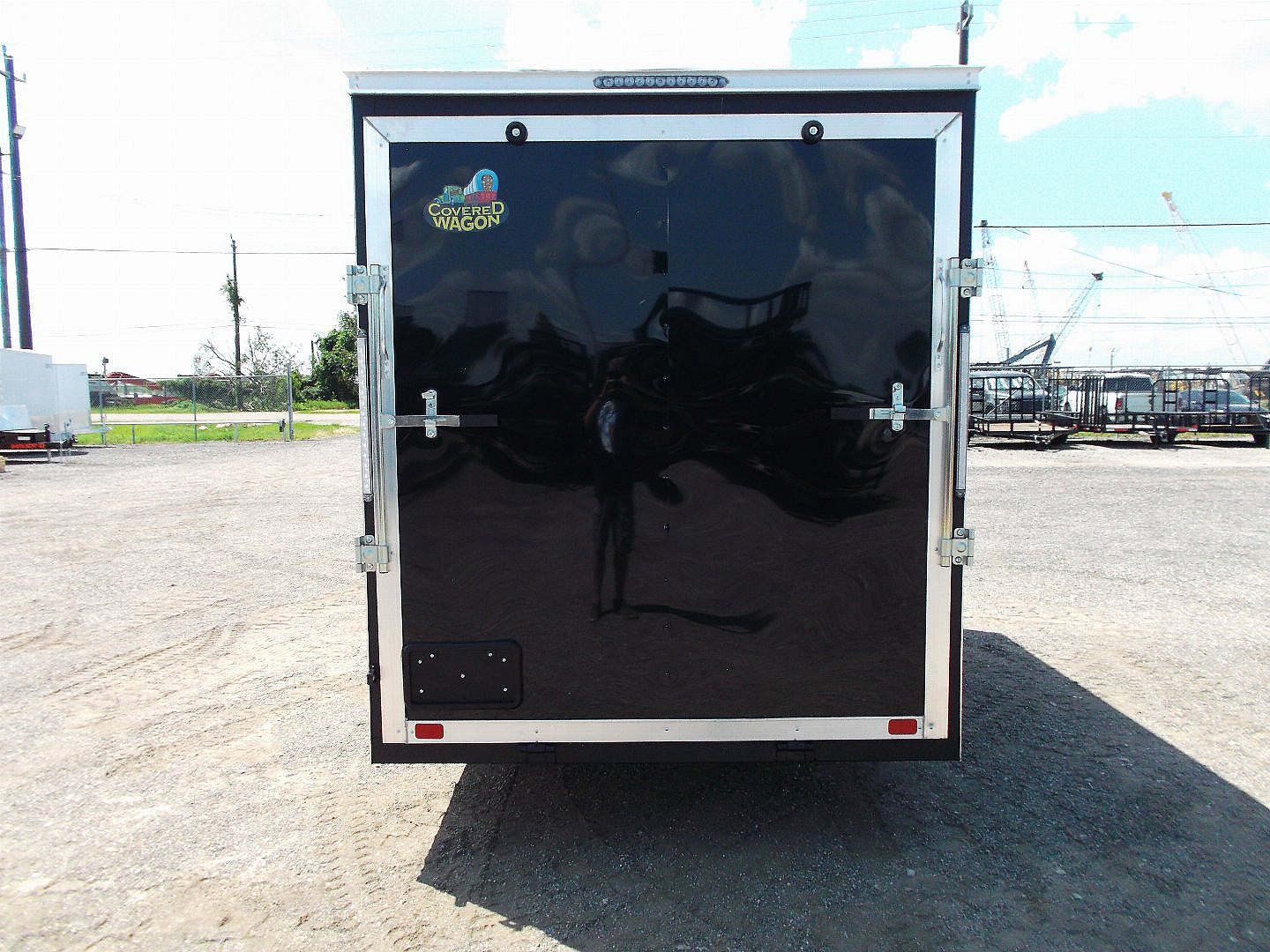 New 2025 Covered Wagon Trailers 6x12 SA Cargo / Enclosed Trailer / Extra Wide Ramp / 36" RV Side Door / 6'6" Interior / Bed Lined Tongue and Frame / (4) D-Rings / .030 Black Semi-Screwless Exterior