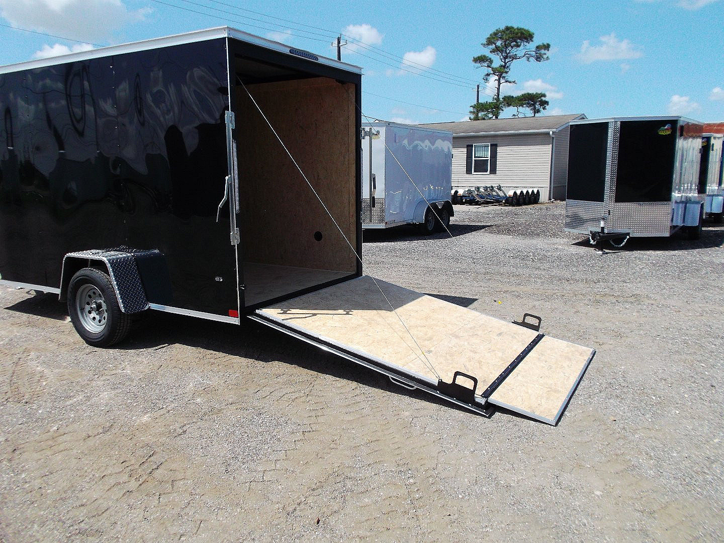 New 2025 Covered Wagon Trailers 6x12 SA Cargo / Enclosed Trailer / Extra Wide Ramp / 36" RV Side Door / 6'6" Interior / Bed Lined Tongue and Frame / (4) D-Rings / .030 Black Semi-Screwless Exterior