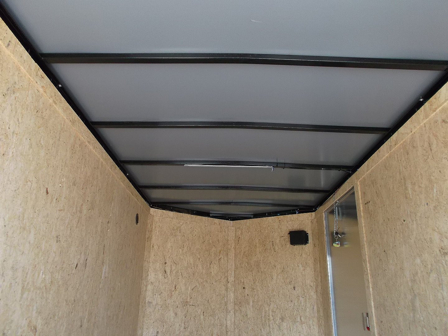 New 2025 Covered Wagon Trailers 6x12 SA Cargo / Enclosed Trailer / Extra Wide Ramp / 36" RV Side Door / 6'6" Interior / Bed Lined Tongue and Frame / (4) D-Rings / .030 Black Semi-Screwless Exterior