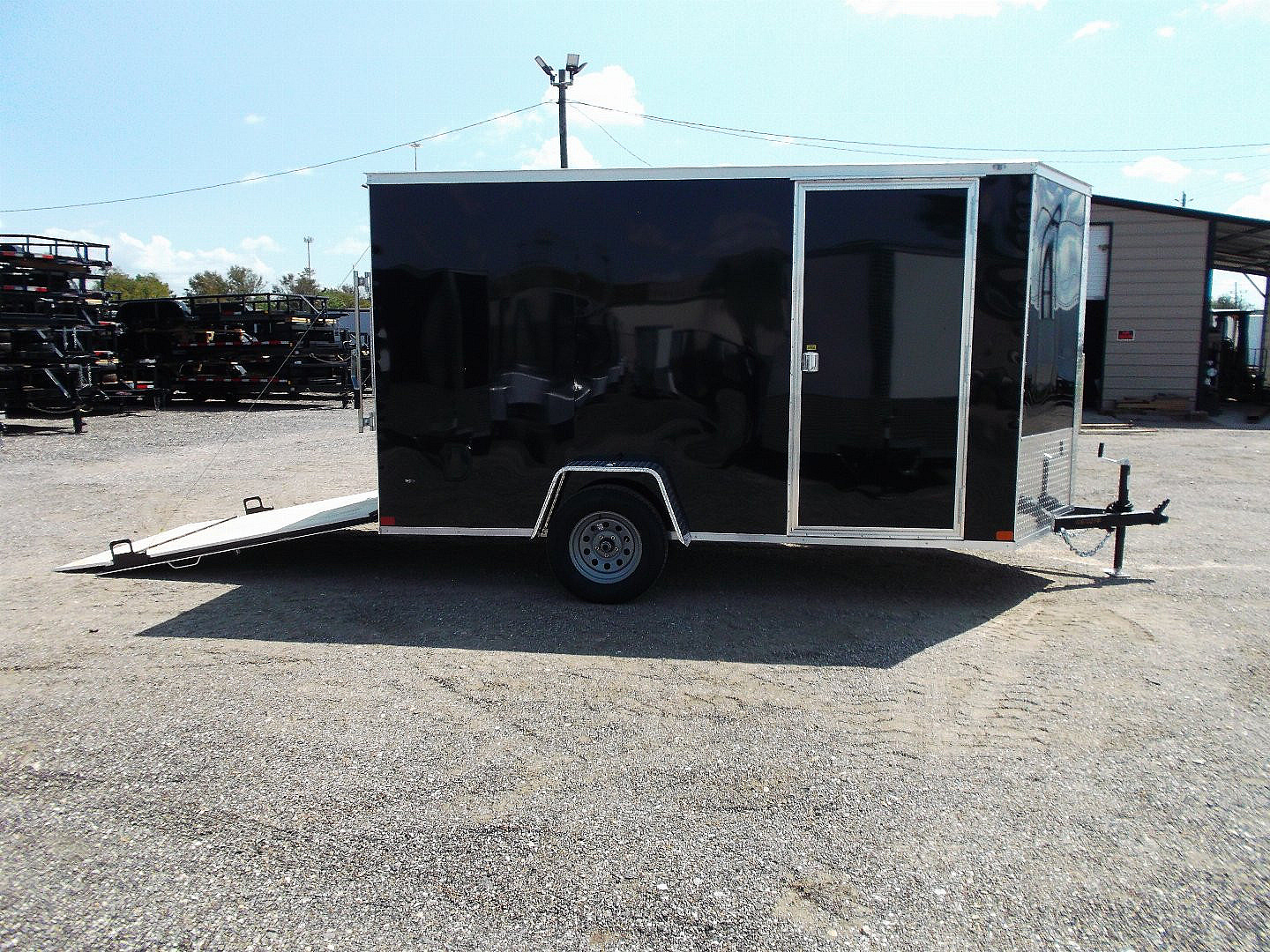 New 2025 Covered Wagon Trailers 6x12 SA Cargo / Enclosed Trailer / Extra Wide Ramp / 36" RV Side Door / 6'6" Interior / Bed Lined Tongue and Frame / (4) D-Rings / .030 Black Semi-Screwless Exterior