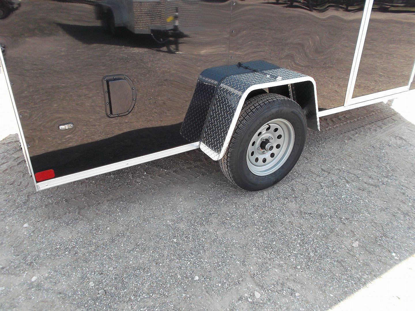 New 2025 Covered Wagon Trailers 6x12 SA Cargo / Enclosed Trailer / Extra Wide Ramp / 36" RV Side Door / 6'6" Interior / Bed Lined Tongue and Frame / (4) D-Rings / .030 Black Semi-Screwless Exterior