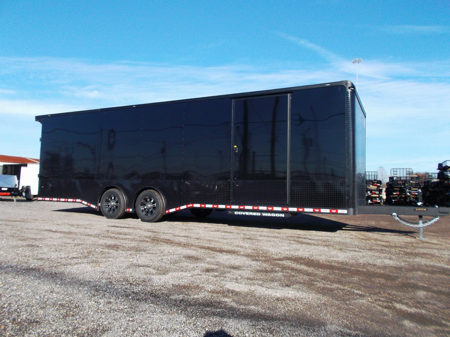 New 2025 COVERED WAGON 8.5x28 Race Trailer / Cargo Trailer / XXL Package / 7'6" Interior Height / Split 7000# Torsion Axles / Heavy Duty Extra Wide Ramp / .080 Black Poly Core / Rear Spoiler w/ LEDS / Side Wall Escape Door / Mag Wheels / Black Out Package