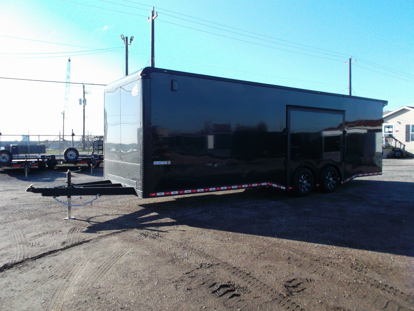 New 2025 COVERED WAGON 8.5x28 Race Trailer / Cargo Trailer / XXL Package / 7'6" Interior Height / Split 7000# Torsion Axles / Heavy Duty Extra Wide Ramp / .080 Black Poly Core / Rear Spoiler w/ LEDS / Side Wall Escape Door / Mag Wheels / Black Out Package