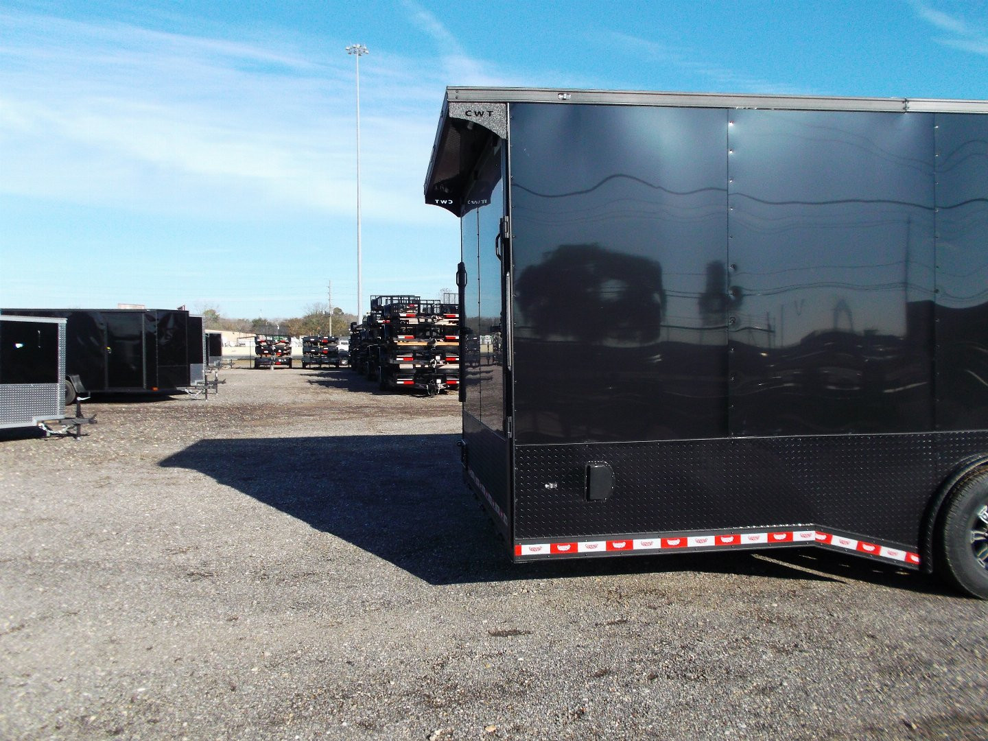 New 2025 COVERED WAGON 8.5x28 Race Trailer / Cargo Trailer / XXL Package / 7'6" Interior Height / Split 7000# Torsion Axles / Heavy Duty Extra Wide Ramp / .080 Black Poly Core / Rear Spoiler w/ LEDS / Side Wall Escape Door / Mag Wheels / Black Out Package